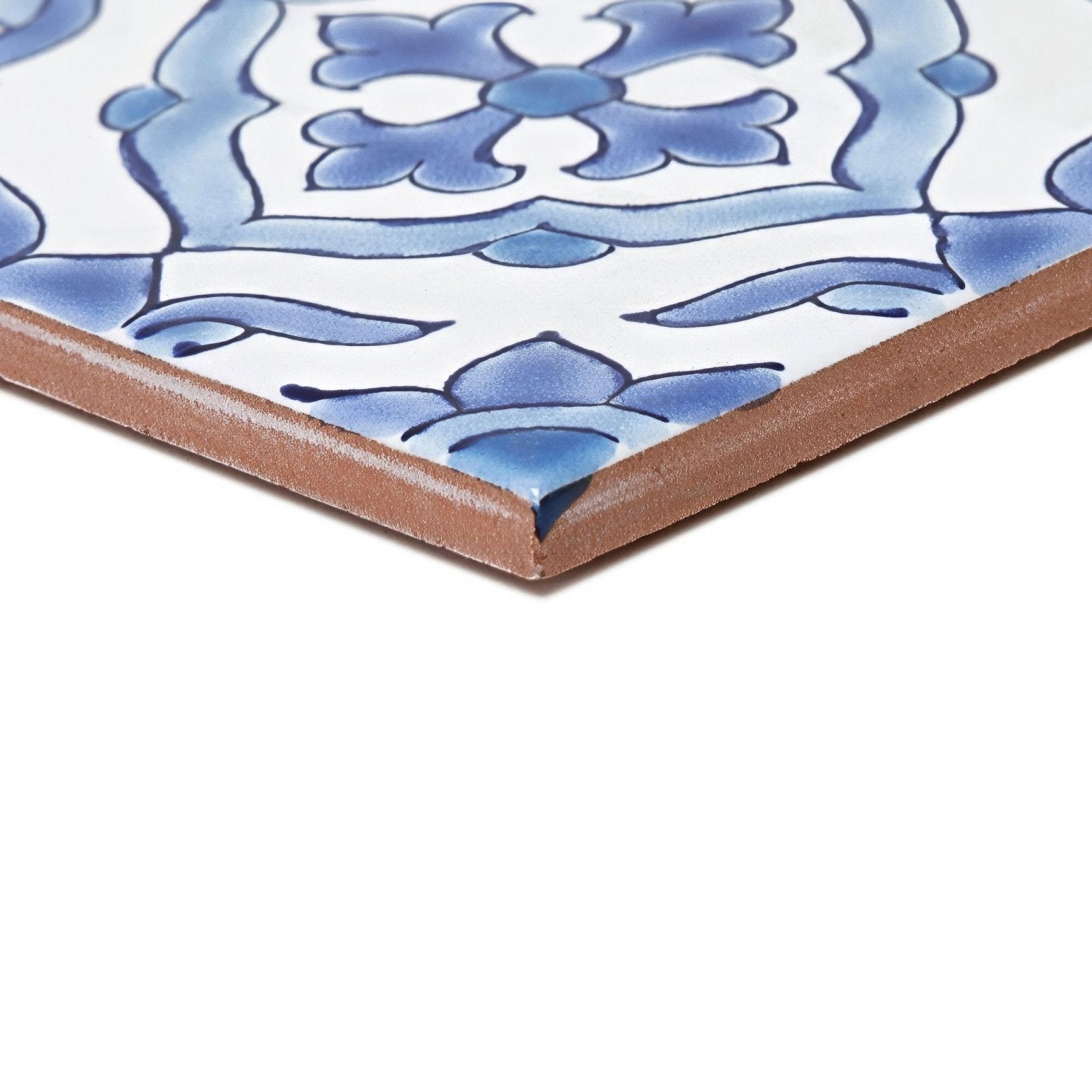 Blue and white ceramic tile with intricate floral design featuring the andalucia jerez patterned tile style