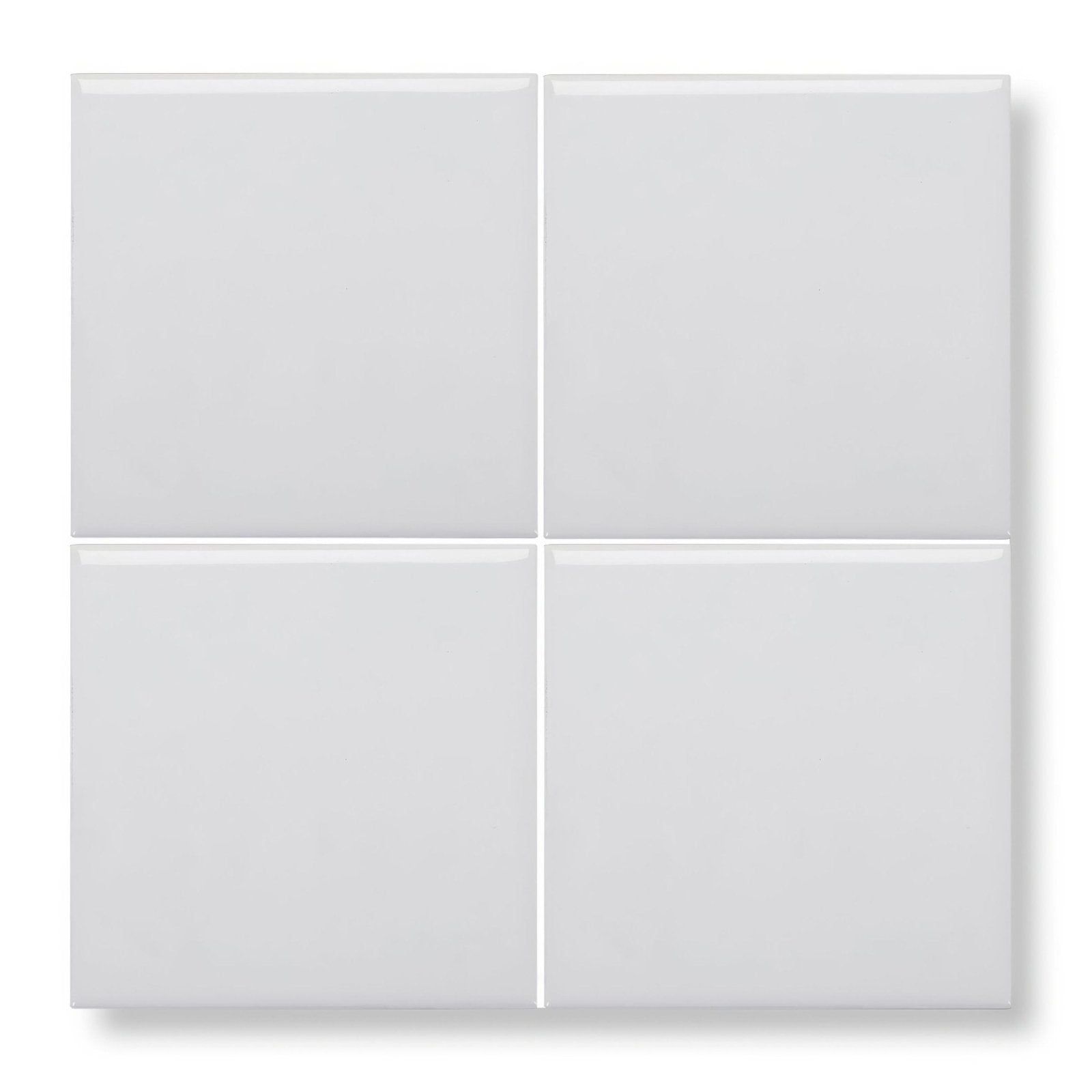 Set of four glossy white square glazed tiles arranged in a grid for wall or floor use in Andalucia white style