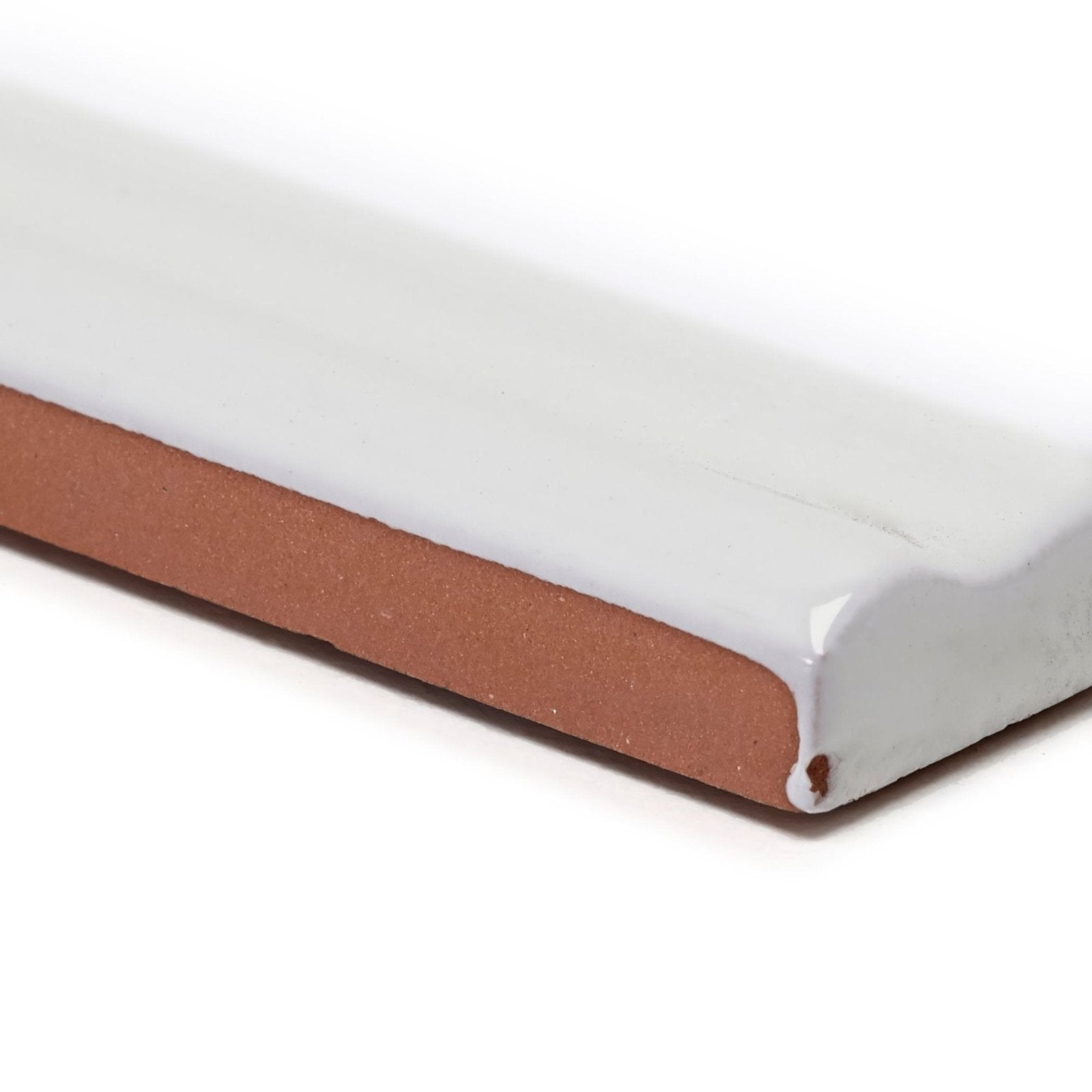 Andalucia White glazed dado ceramic tile showing white glaze front and terracotta-colored underside back side view