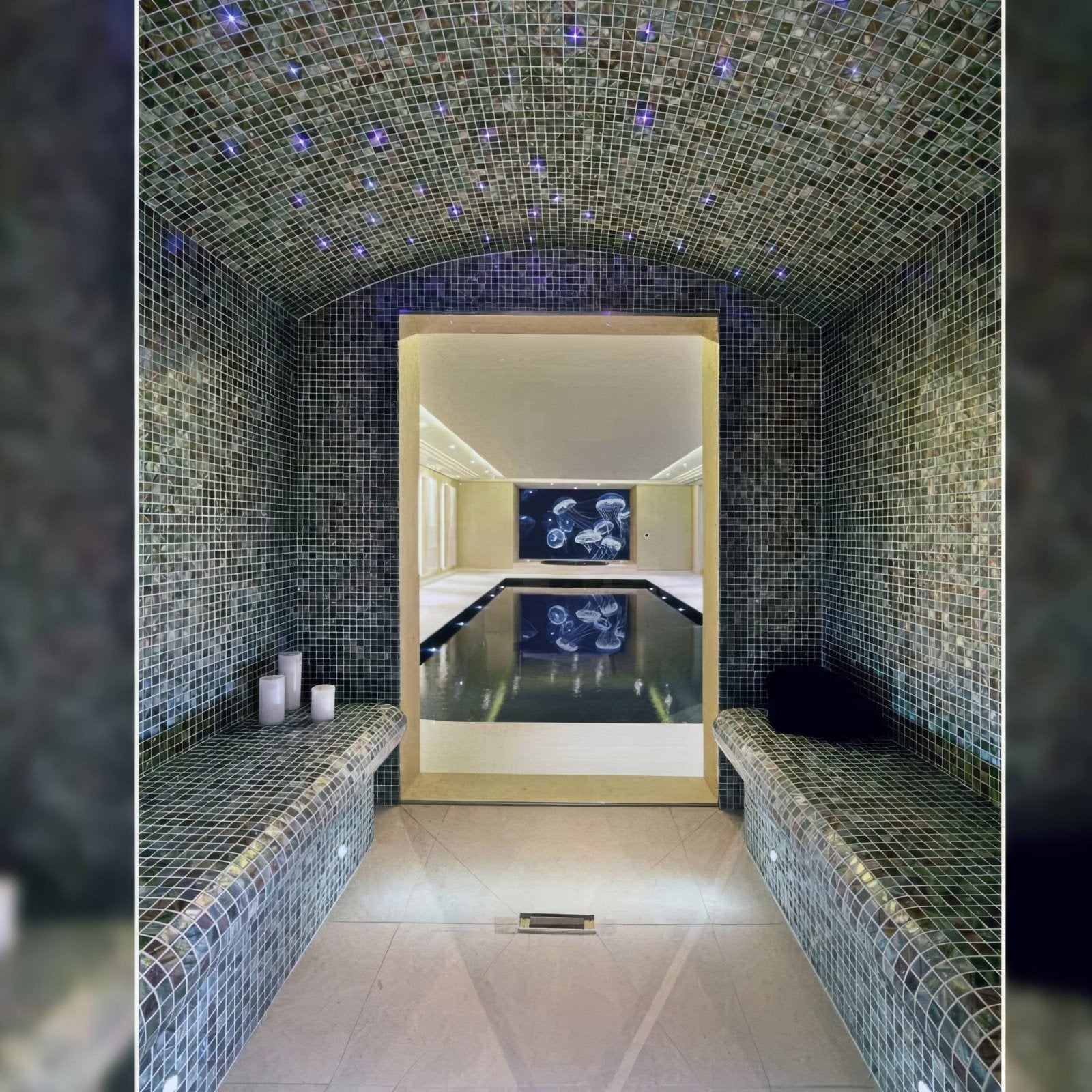 Anthracite 25mm square dark blue mosaic tiles in a luxurious arched steam room with purple star-like lights