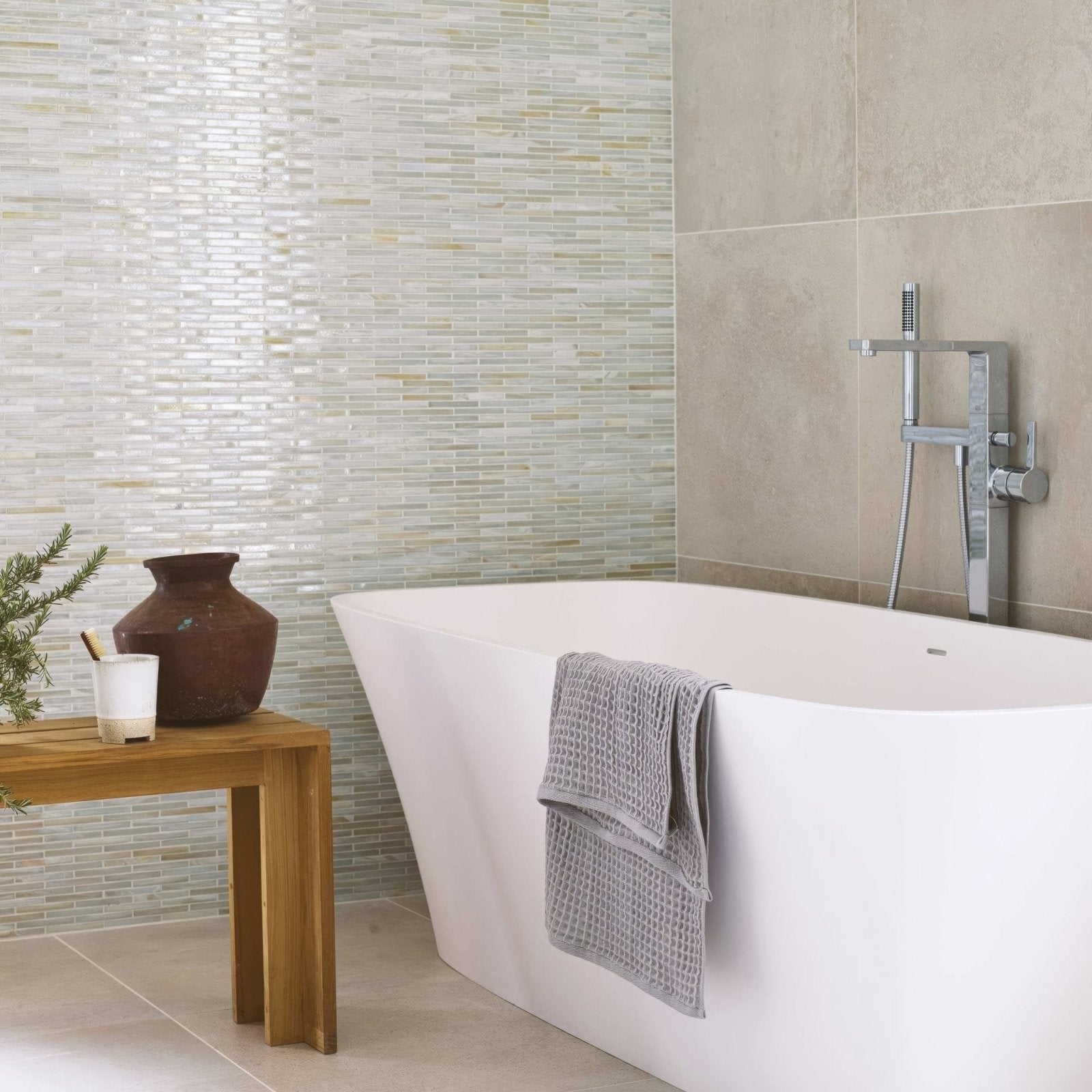 Arabian Sea Pasni glass mosaic white and beige glass mosaic in a bathroom with a freestanding bathtub