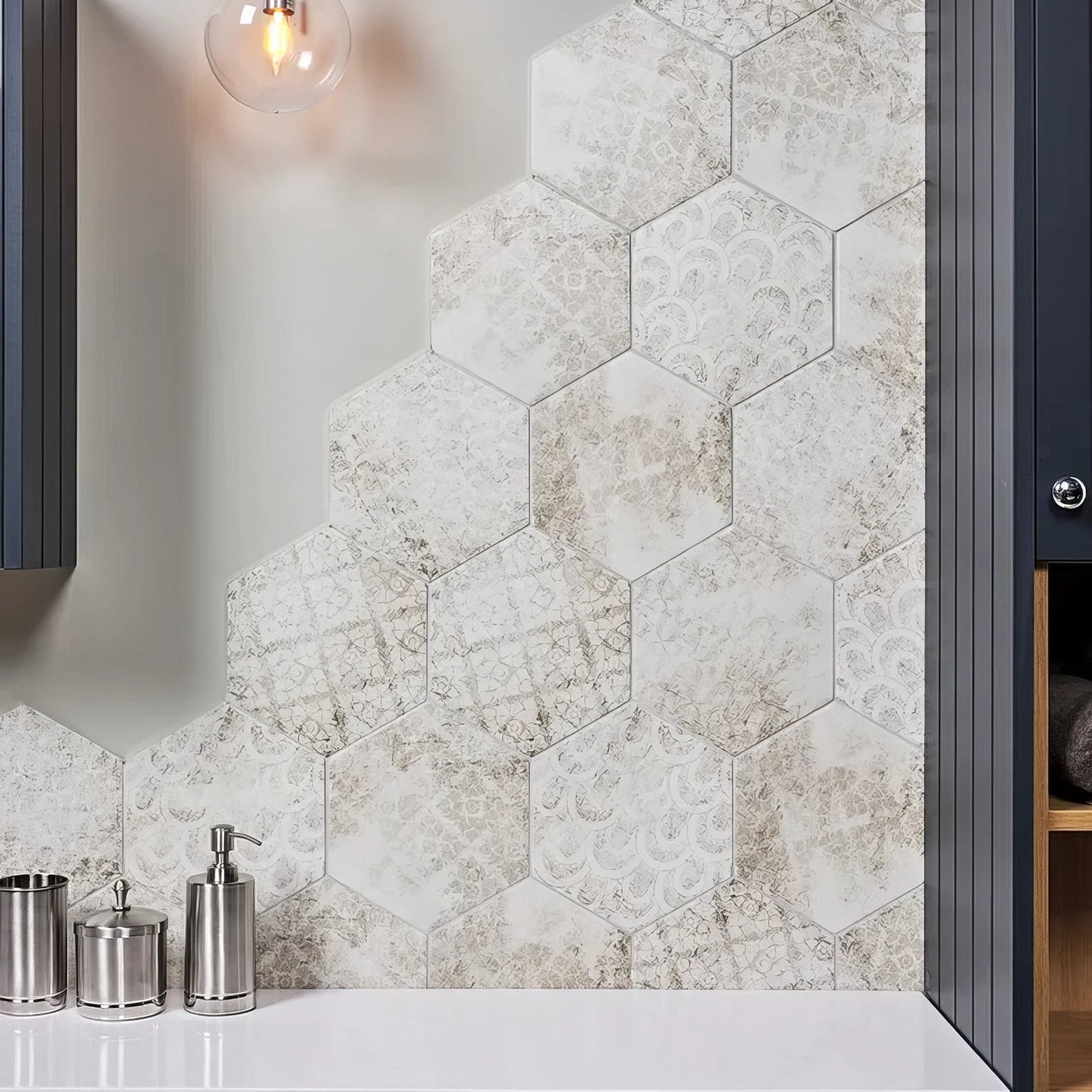 White hexagonal porcelain tiles from architectural elements melange with subtle silver floral geometric pattern