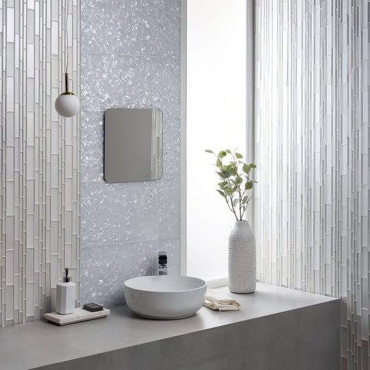 Textured gray ceramic vase with vertical ridges featured in arctic crushed pearl decorative glass collection