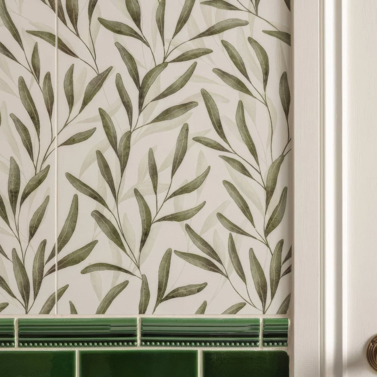 The arts & crafts willow 60x30cm wallpaper features olive green leafy branches on off-white with a green tile border