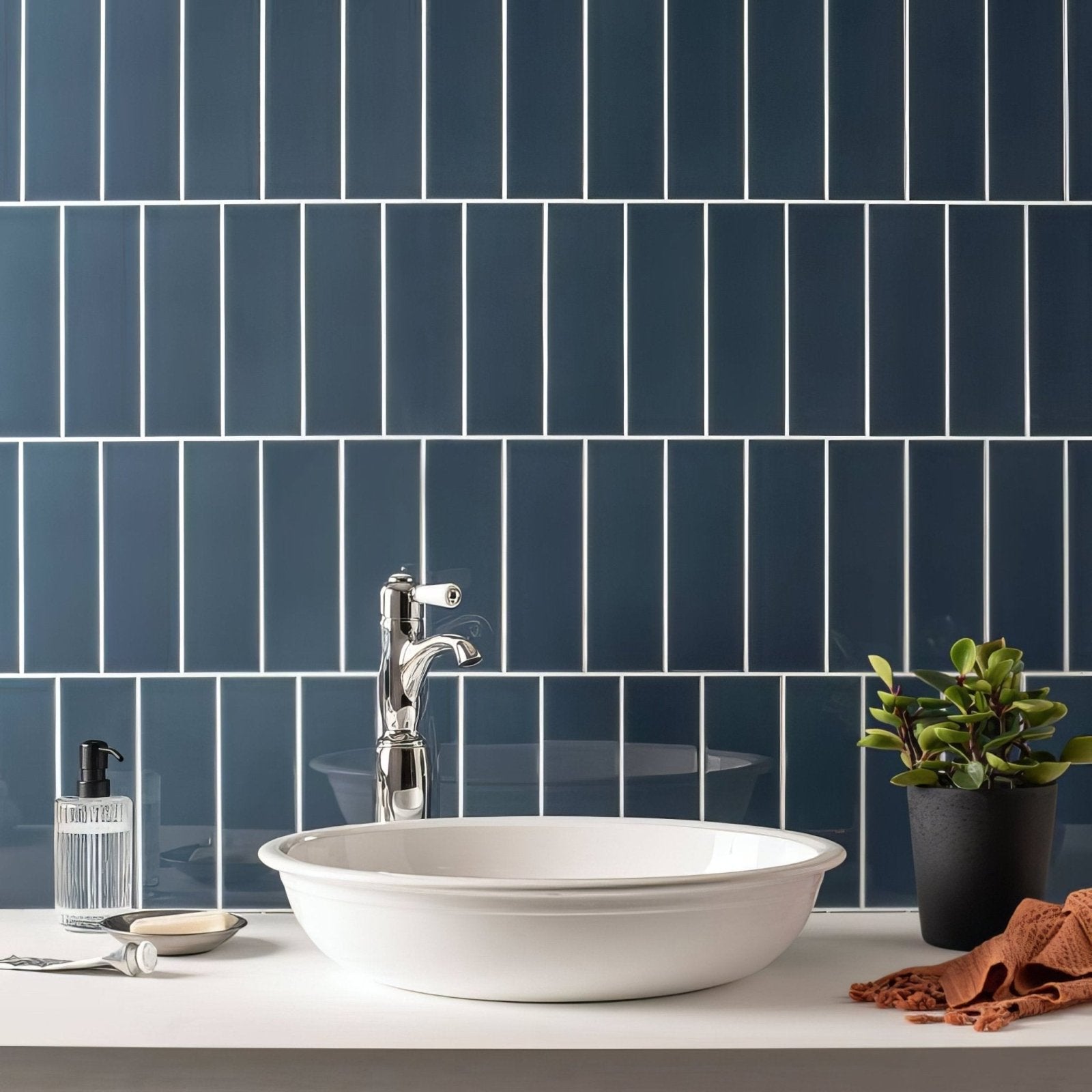 White ceramic vessel sink with a sleek rounded bowl shape featured in the ascot blue large brick collection