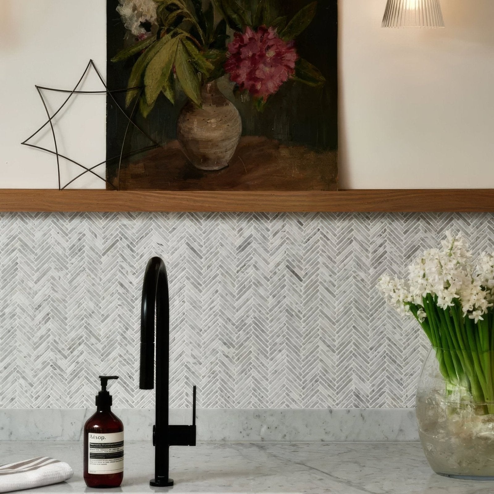 Black matte finish kitchen faucet with sleek curved spout and minimalist design for Athens Carrara marble mosaic sink