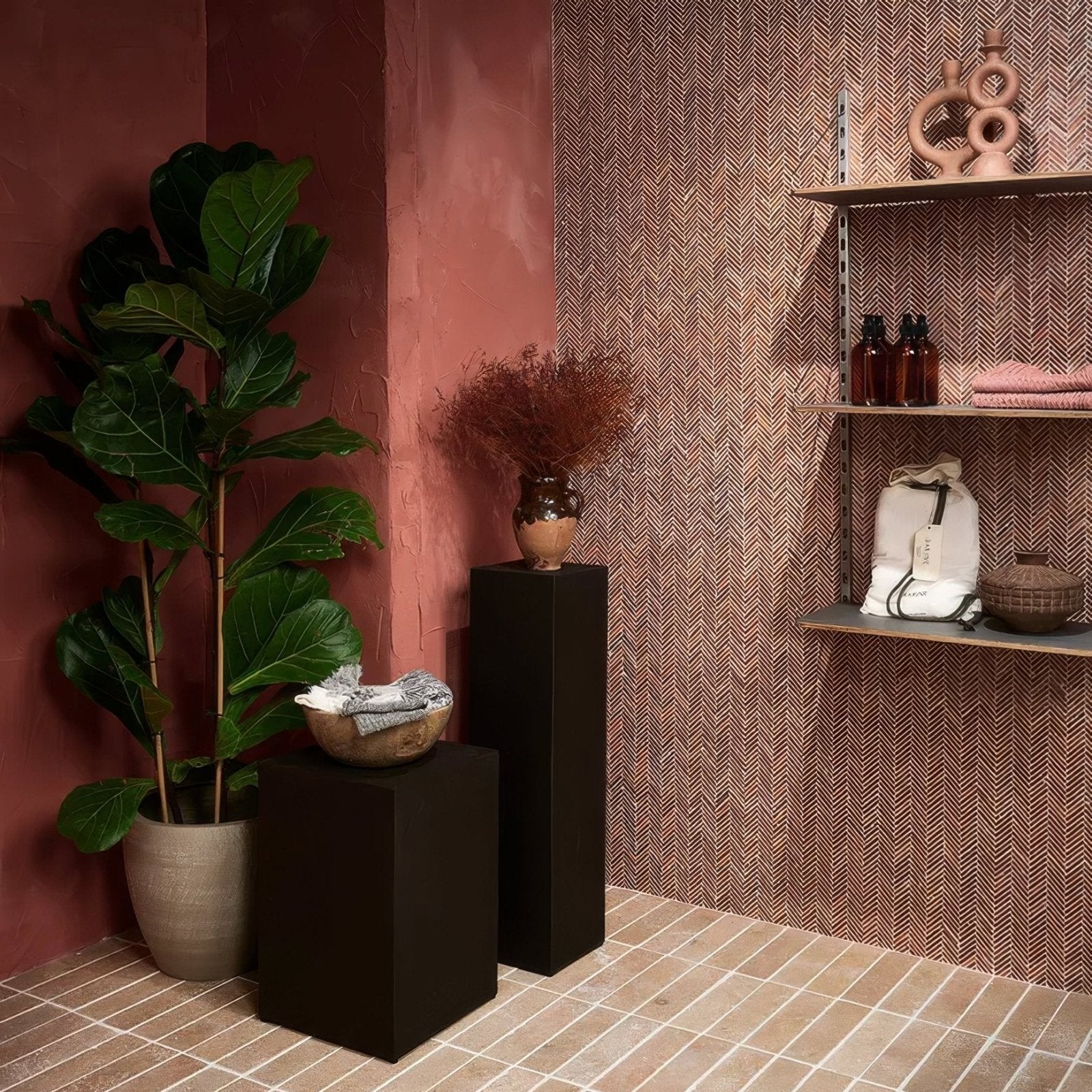 A white canvas tote bag with black trim and a tag resting on a wooden shelf featuring athens rosso travertine mosaic design