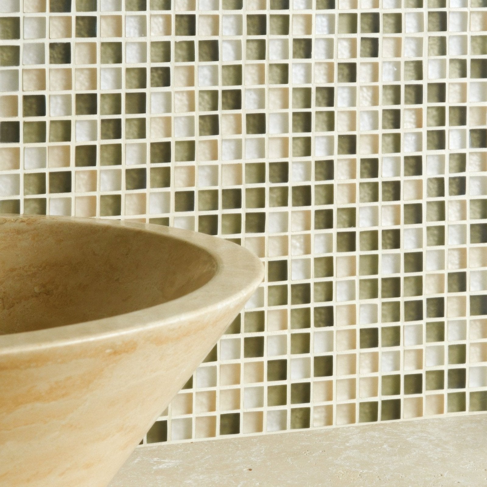 Beige and olive green aura mosaic tile backsplash with stone sink in the foreground for kitchen decor