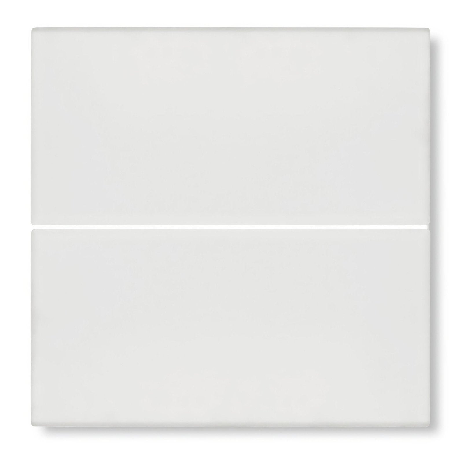 Two sleek glossy white rectangular glass tiles stacked vertically from aurora levi glass tile collection