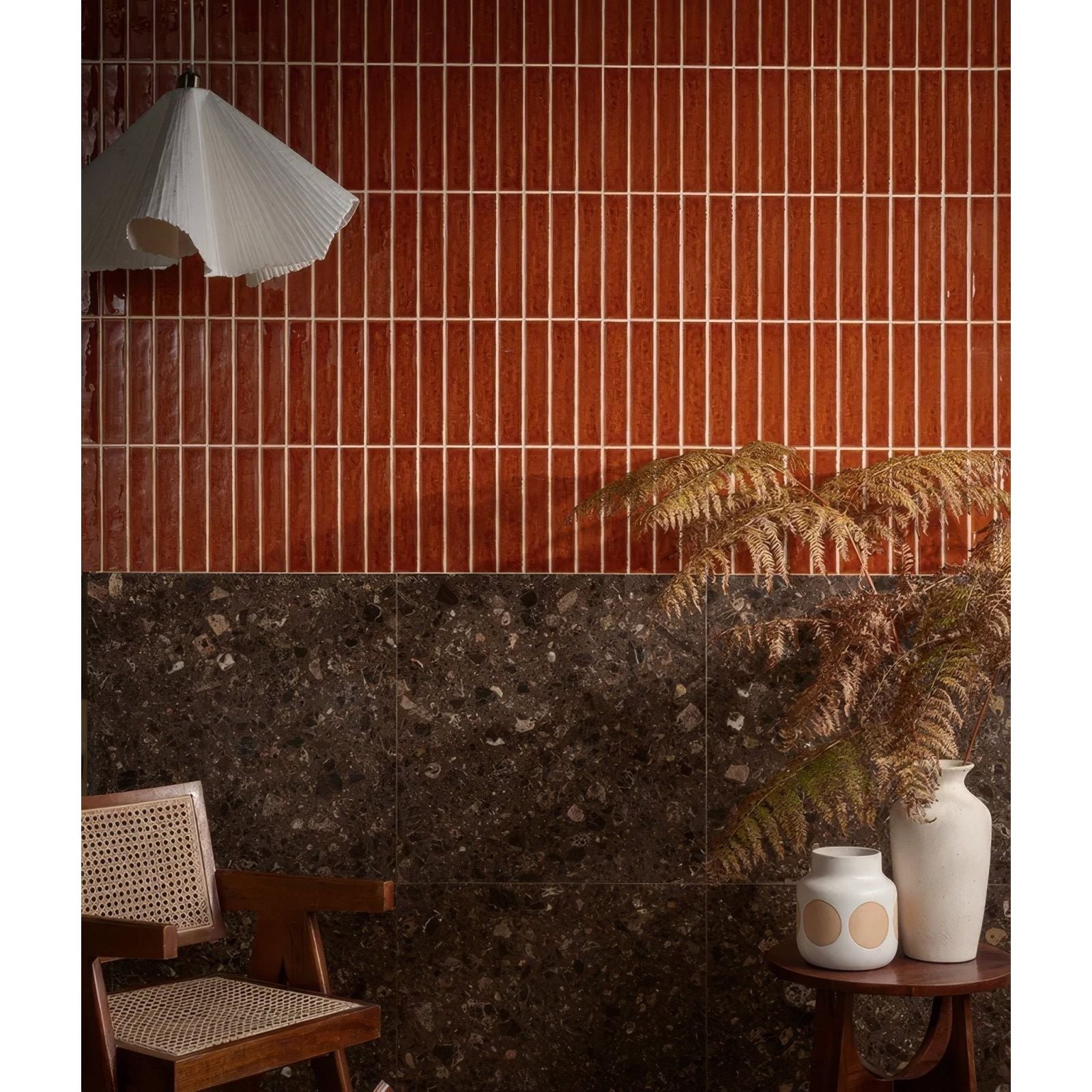 Avebury ceramic burnt caramel wall tiles feature two-toned vertical design with terracotta and dark speckled stone