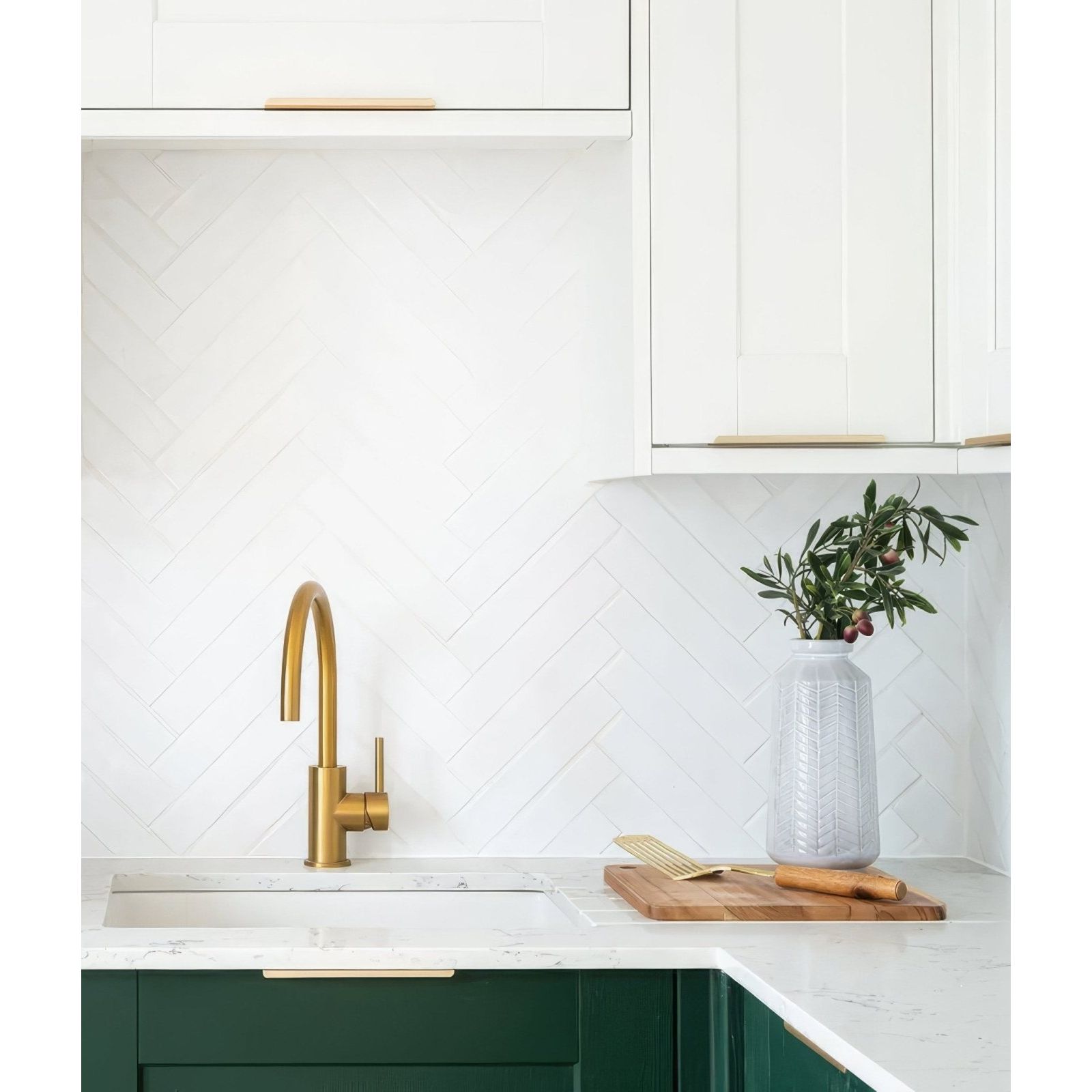 Gold-toned kitchen faucet with sleek curved spout and minimalist design for Avebury ceramic milk white sink