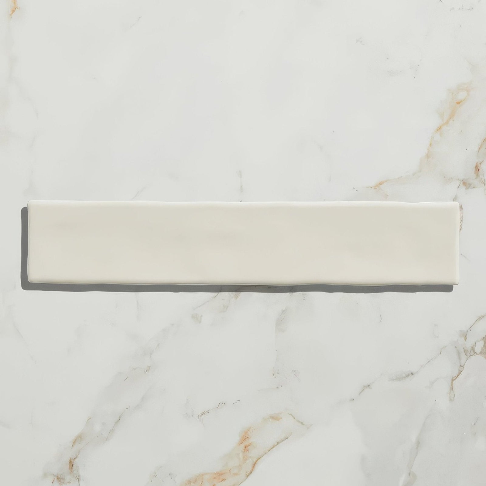 Cream-colored rectangular avebury ceramic parchment tile with smooth glossy finish suitable for flooring or walls