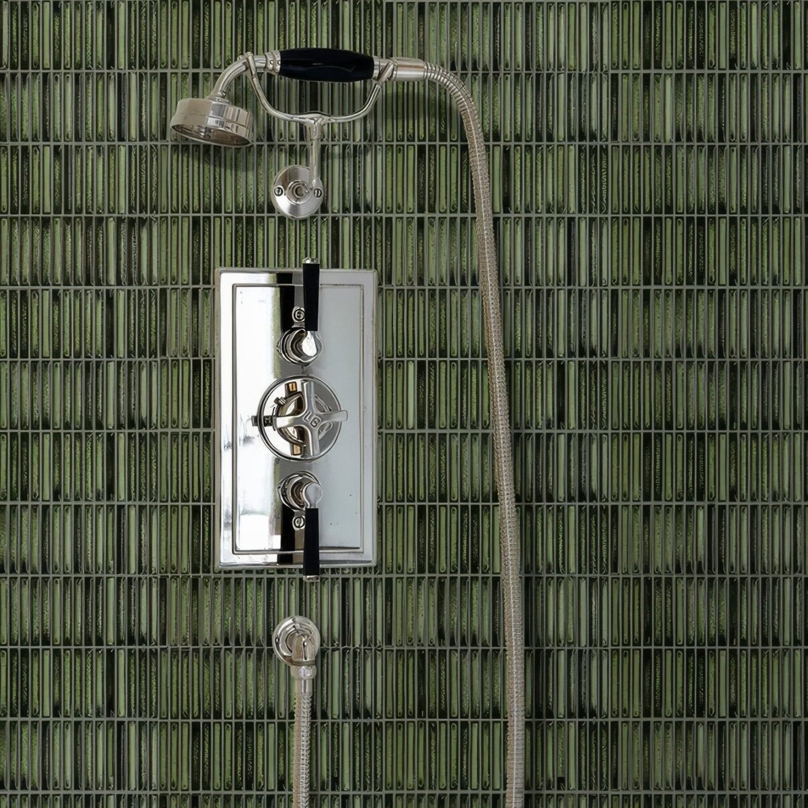 Bamboo Lustre Porcelain Mosaic Forest dark green ribbed porcelain mosaic in a shower with a chrome fixture