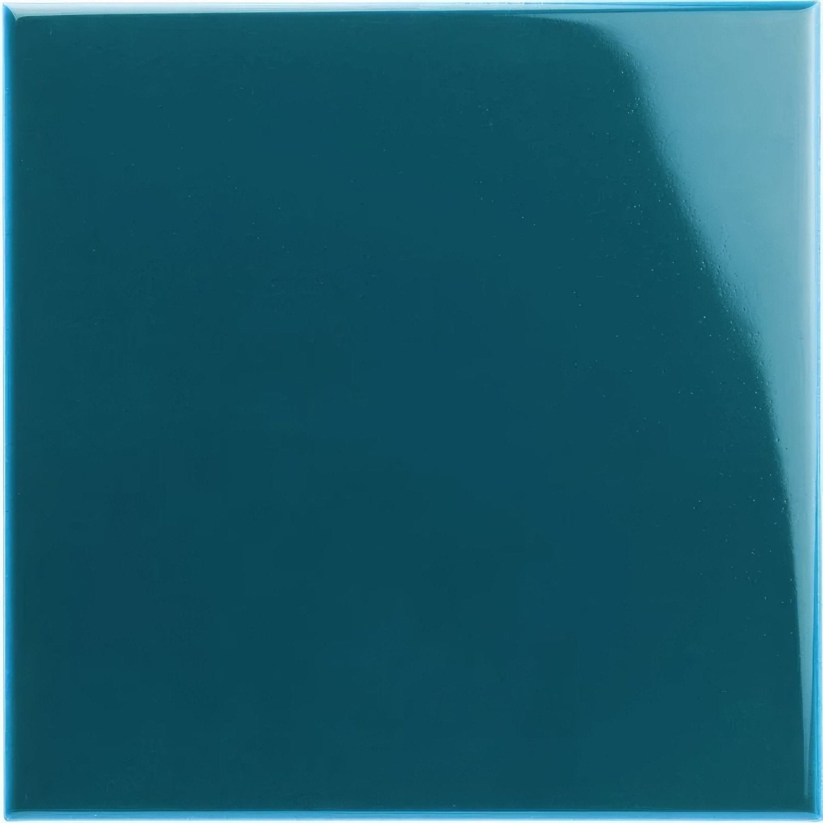 A glossy teal baroque blue field ceramic tile with a smooth reflective surface ideal for wall or floor use