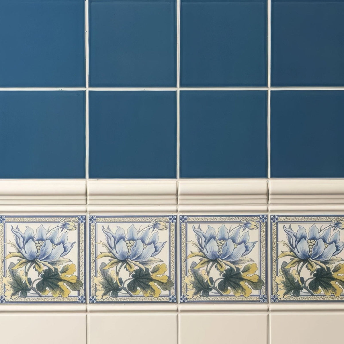 Baroque blue field tile featuring blue and white ceramic with delicate lavender yellow and green floral designs