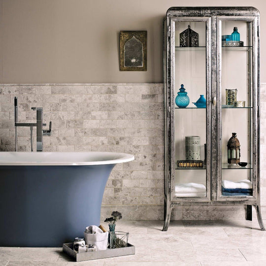Basswood antique-style silver-framed glass display cabinet with distressed metal finish showcasing blue ceramics and lanterns