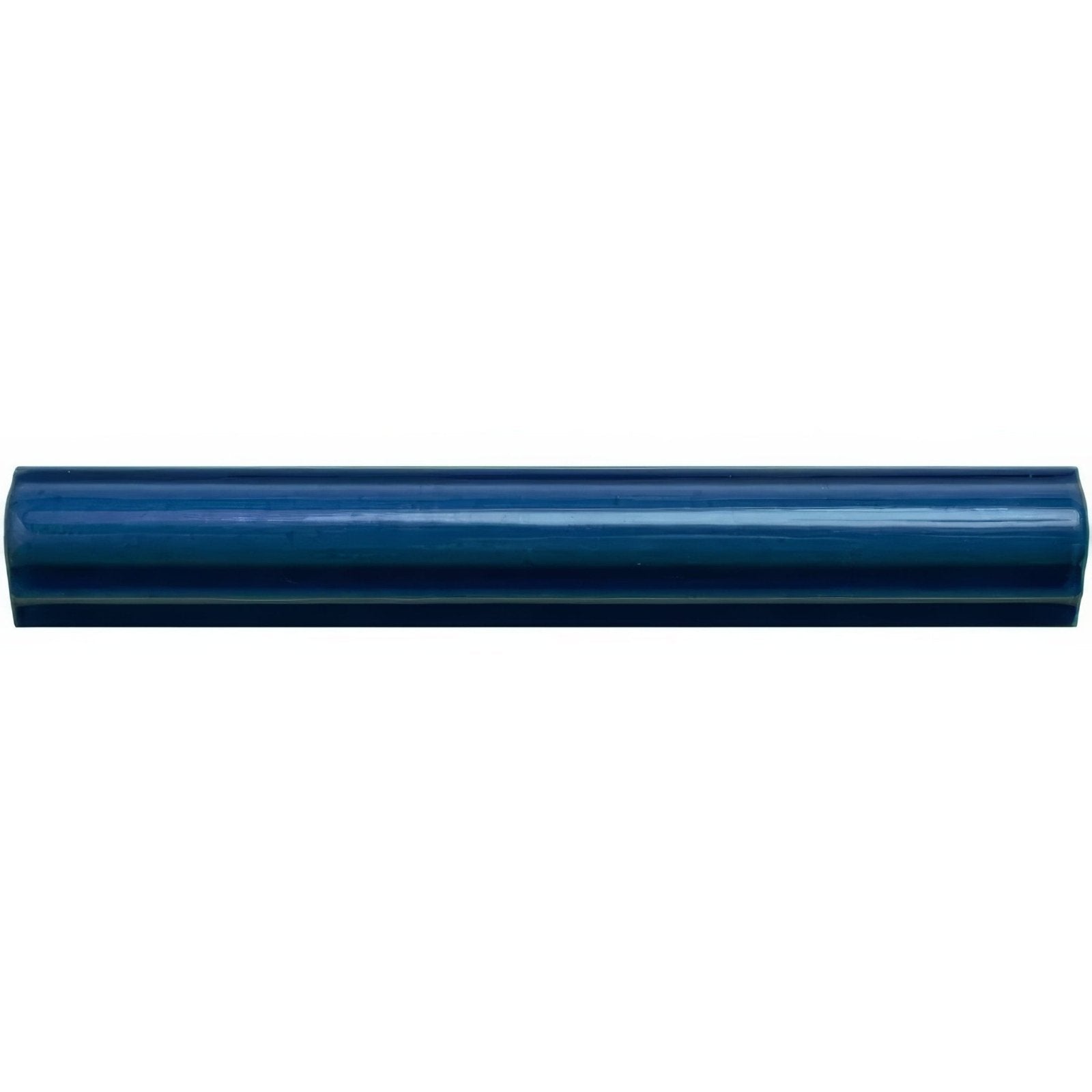 A glossy navy blue ceramic bastille ogee moulding tile with smooth rounded edges and subtle gradient finish