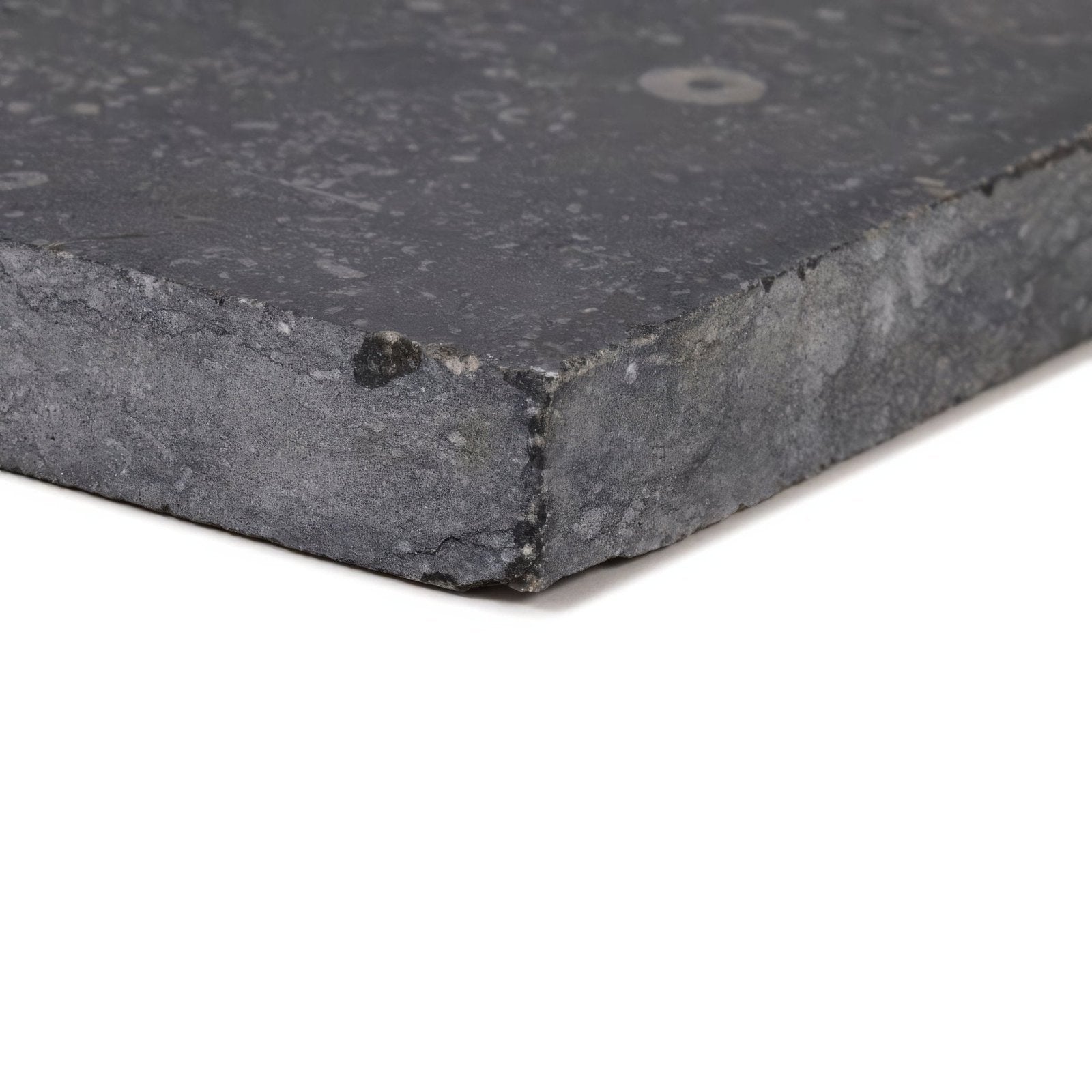 Dark gray belgian bleu tumbled stone tile with honed light pillow edge and textured natural rough speckles