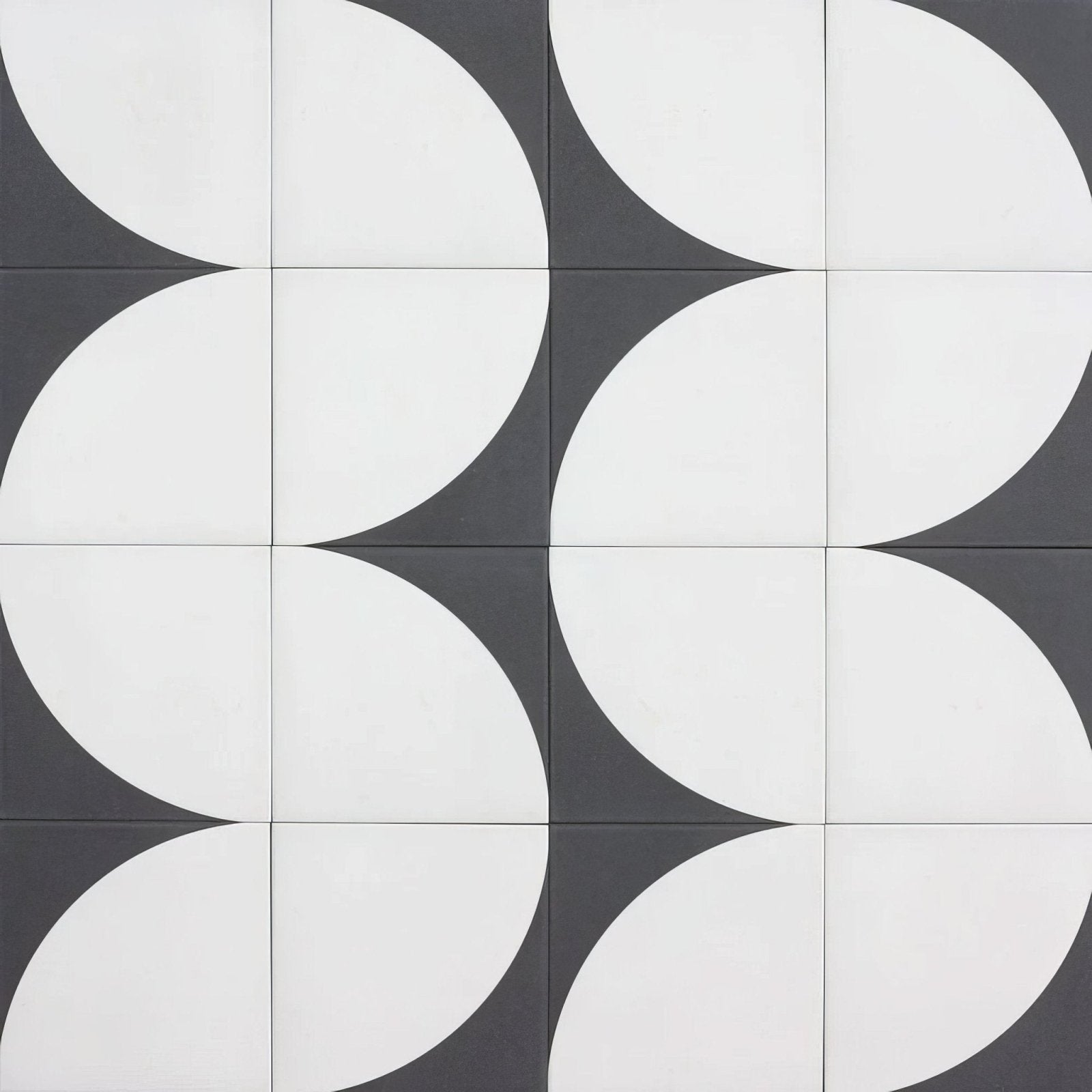 Black and white geometric patterned porcelain floor tiles with modern repeating circular design by bert & may arco old iron