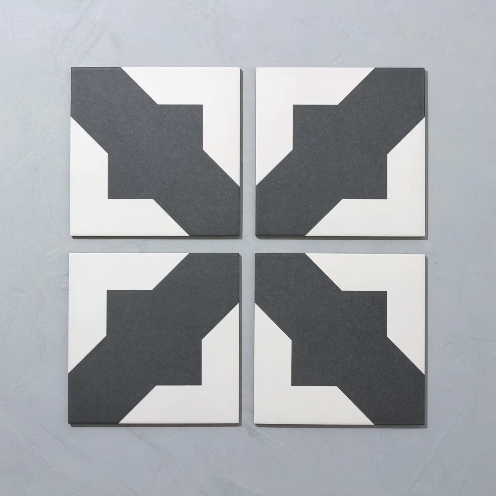 Set of four bert and may black crosses porcelain tiles with bold black and white geometric pattern