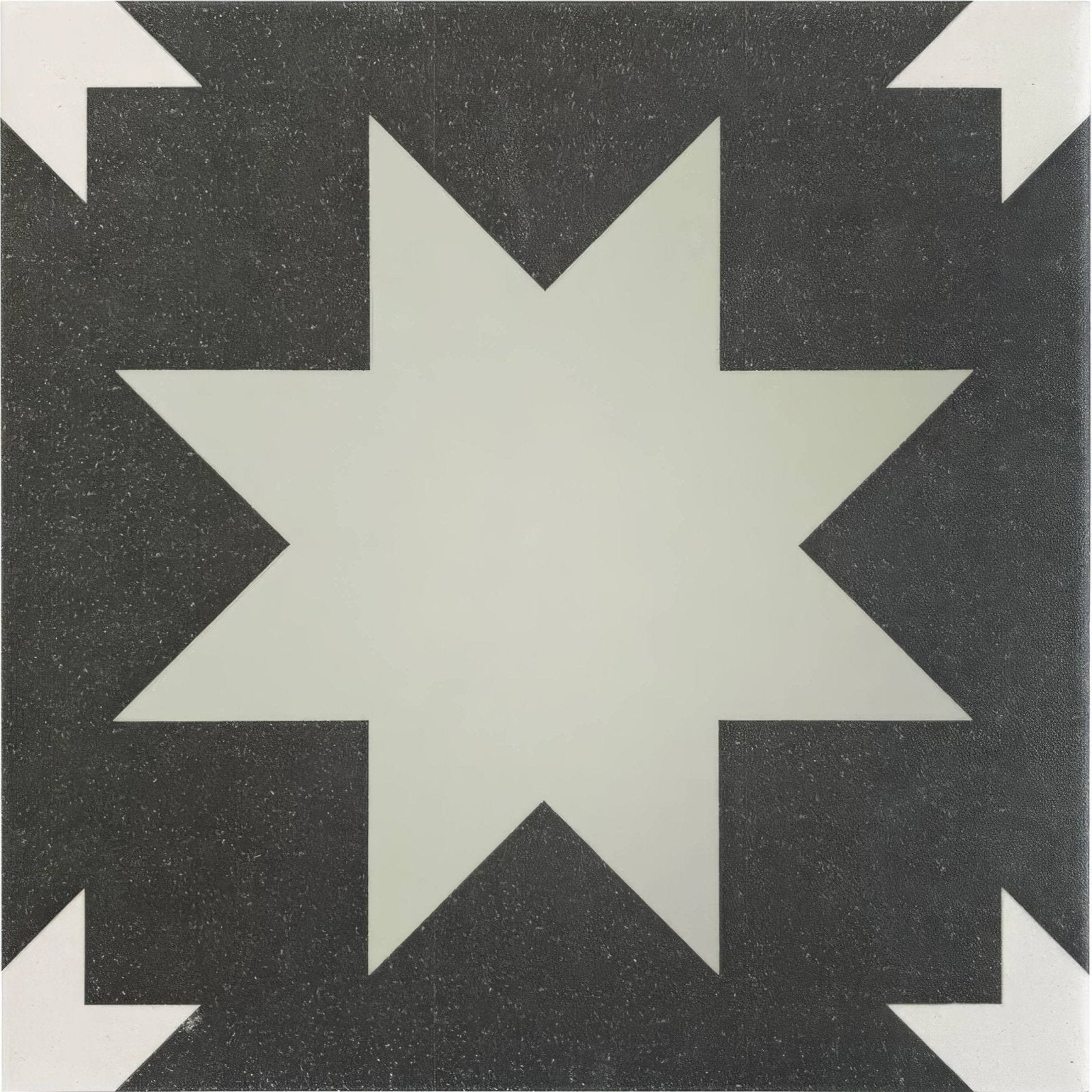 Bert & may black pradena porcelain tile featuring a black and white geometric starburst pattern