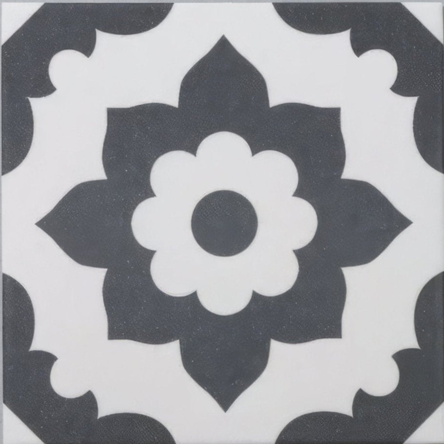 Black and white floral patterned porcelain tile with central flower design from bert and may black santona collection