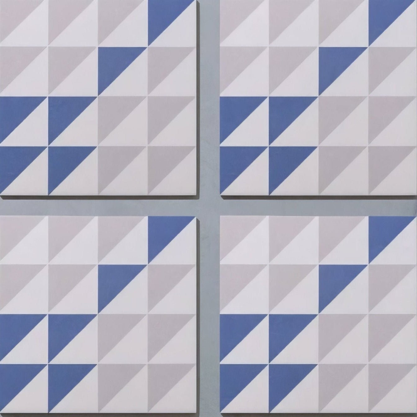 Blue and white geometric patterned porcelain tiles with modern three-dimensional design by bert & may