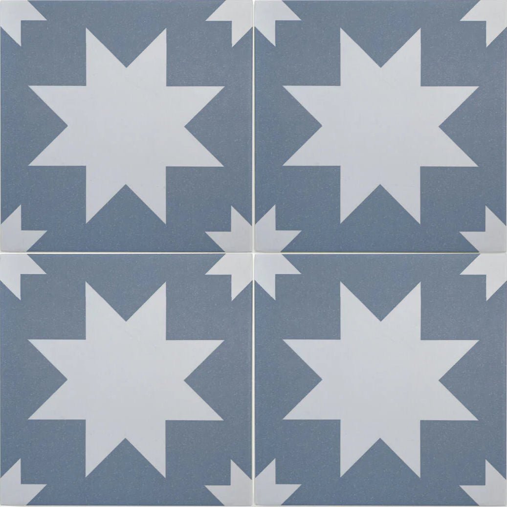 Blue and white star-patterned porcelain floor tiles by bert and may ideal for decorative flooring