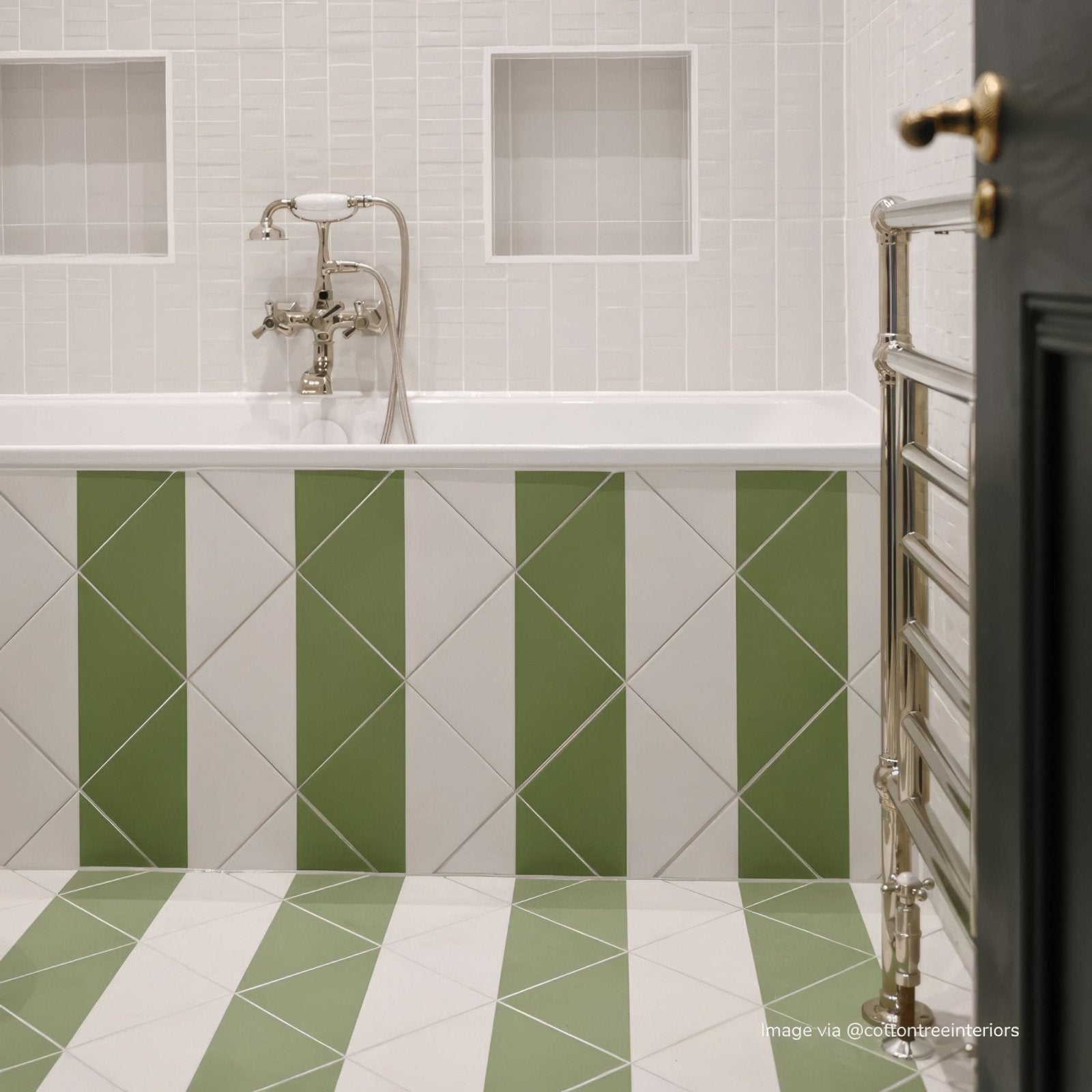 A modern bathroom with a white bathtub and elegant chrome faucet featuring bert and may green alalpardo porcelain tiles