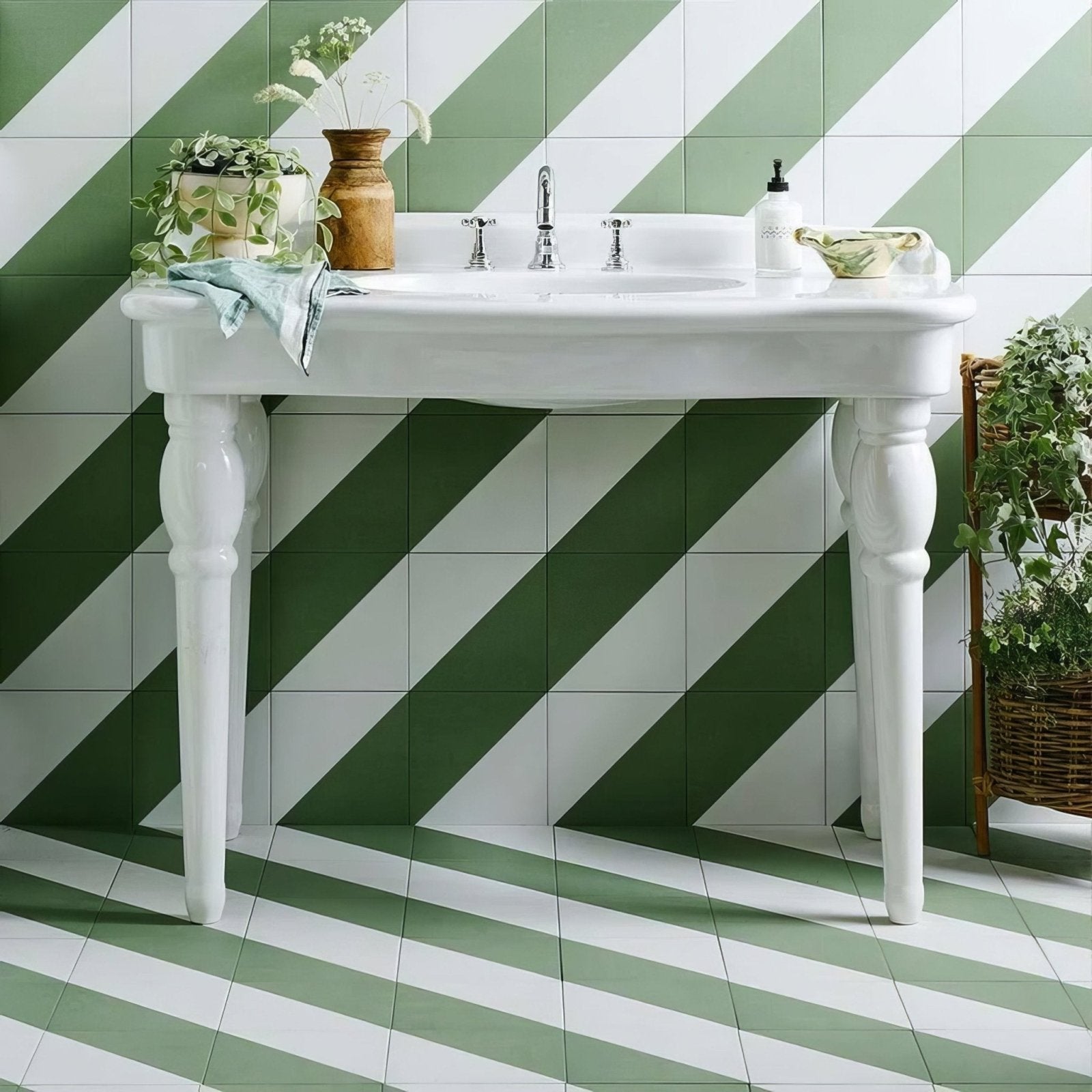 White ceramic pedestal sink with ornate legs and classic design from Bert & May green Alalpardo porcelain collection