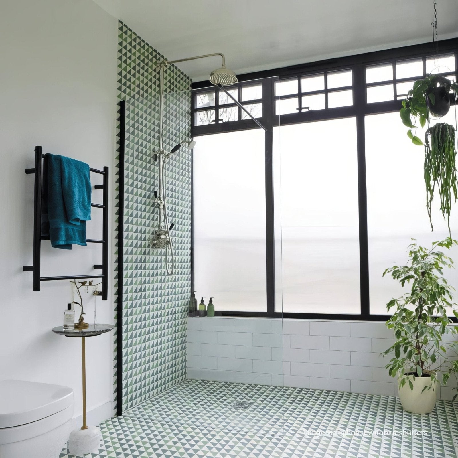 Green and white geometric porcelain tile wall by bert and may in a modern bathroom setting