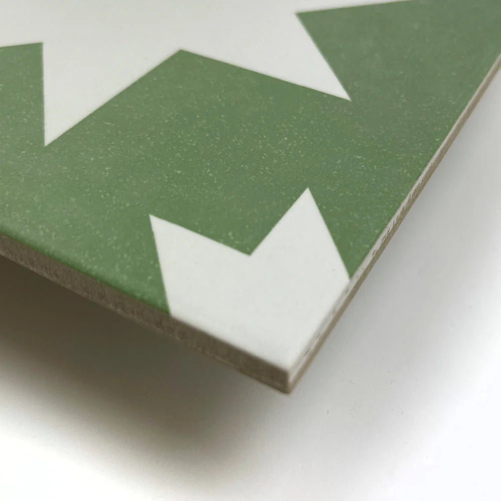 Green and white geometric patterned matte porcelain tile from bert and may pradena collection