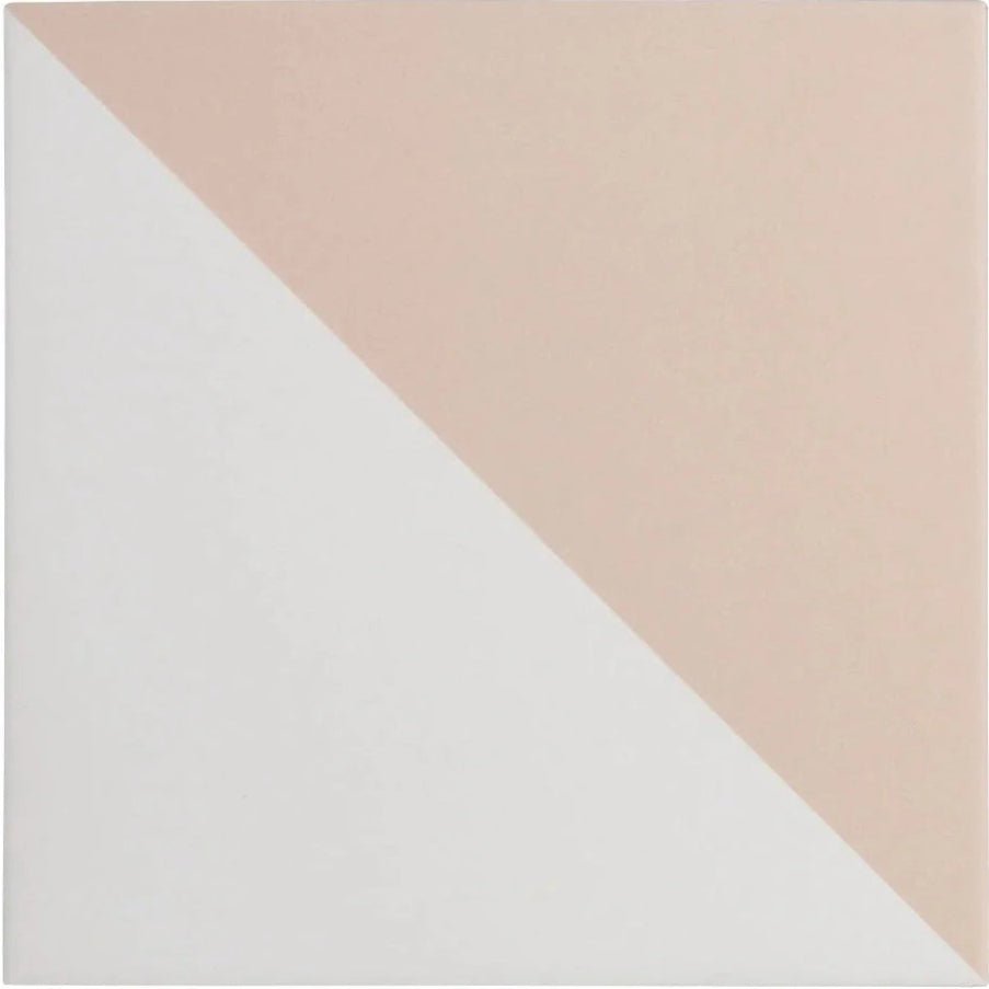 A square bert and may pearl alalpardo porcelain tile split diagonally in soft blush pink and clean white colors