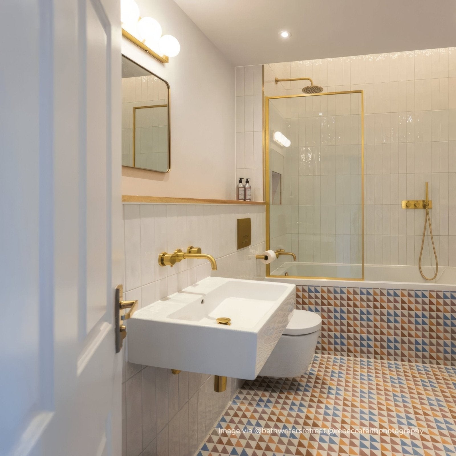 White rectangular porcelain wall-mounted sink with gold-toned fixtures and minimalist design from bert & may soho majadas tile