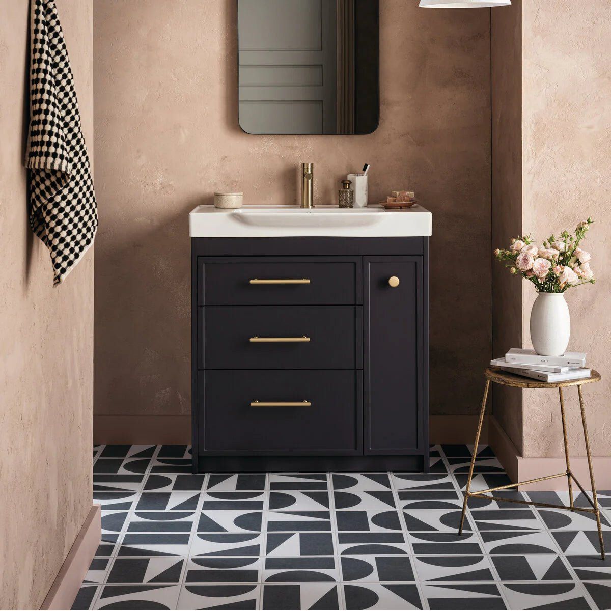Black vanity with gold hardware and white split shift old iron porcelain sink by Bert & May