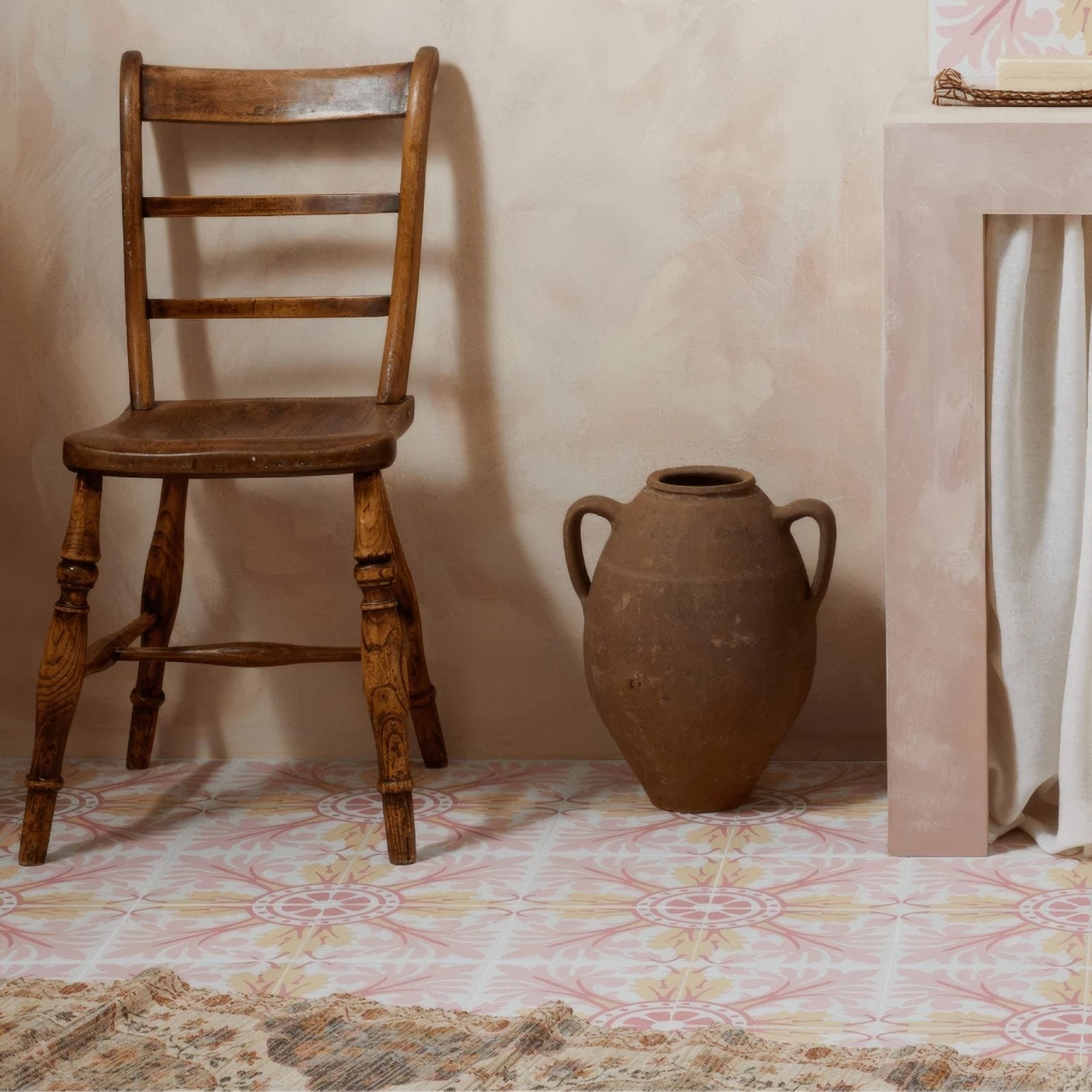 A rustic brown clay amphora with two handles and rounded body featured in bert and may turenne porcelain collection