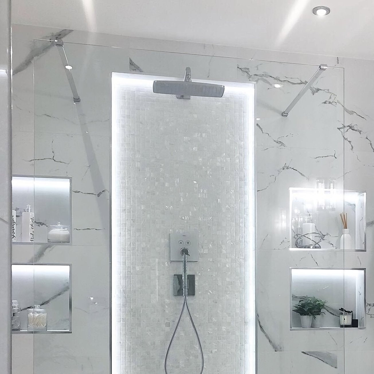 Modern chrome bianco 25mm square showerhead with sleek rectangular design mounted above waterfall tiled wall