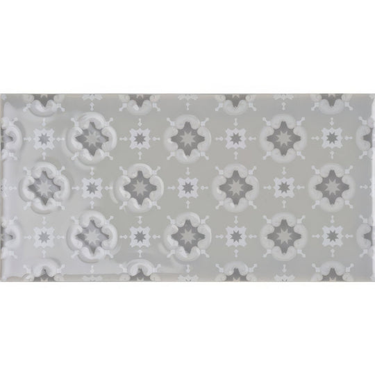 Gray rectangular tile bicton on dunwich with raised star-shaped motifs in varying gray shades for decorative use