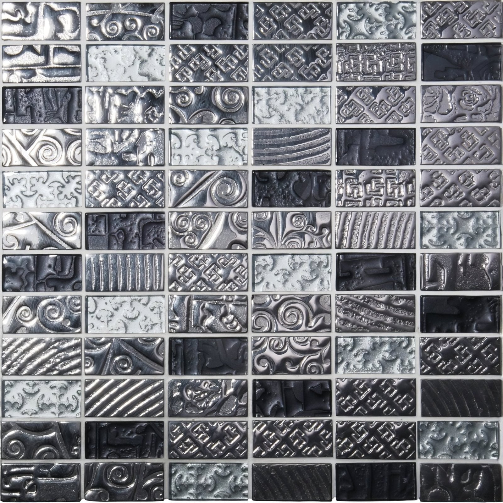Silver and black textured glass mosaic tile with intricate embossed patterns in Bihar mixed mosaic design