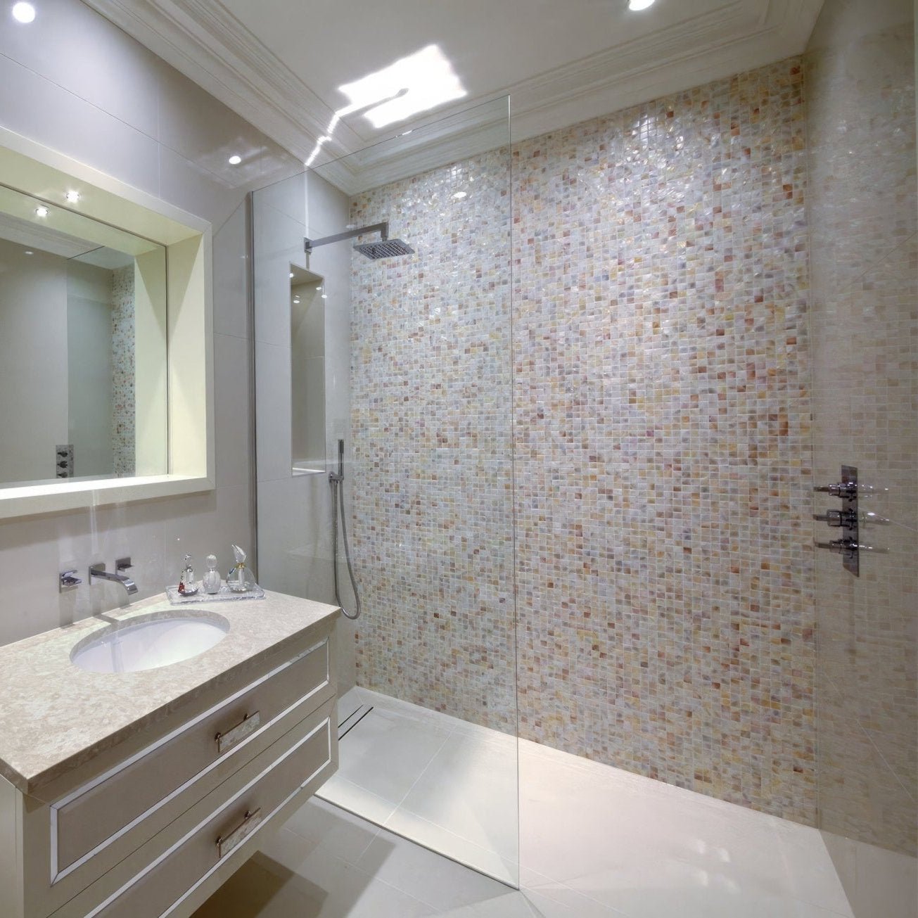 Biscotti 25mm square shower wall tiles in iridescent cream and beige mosaic reflecting light subtly