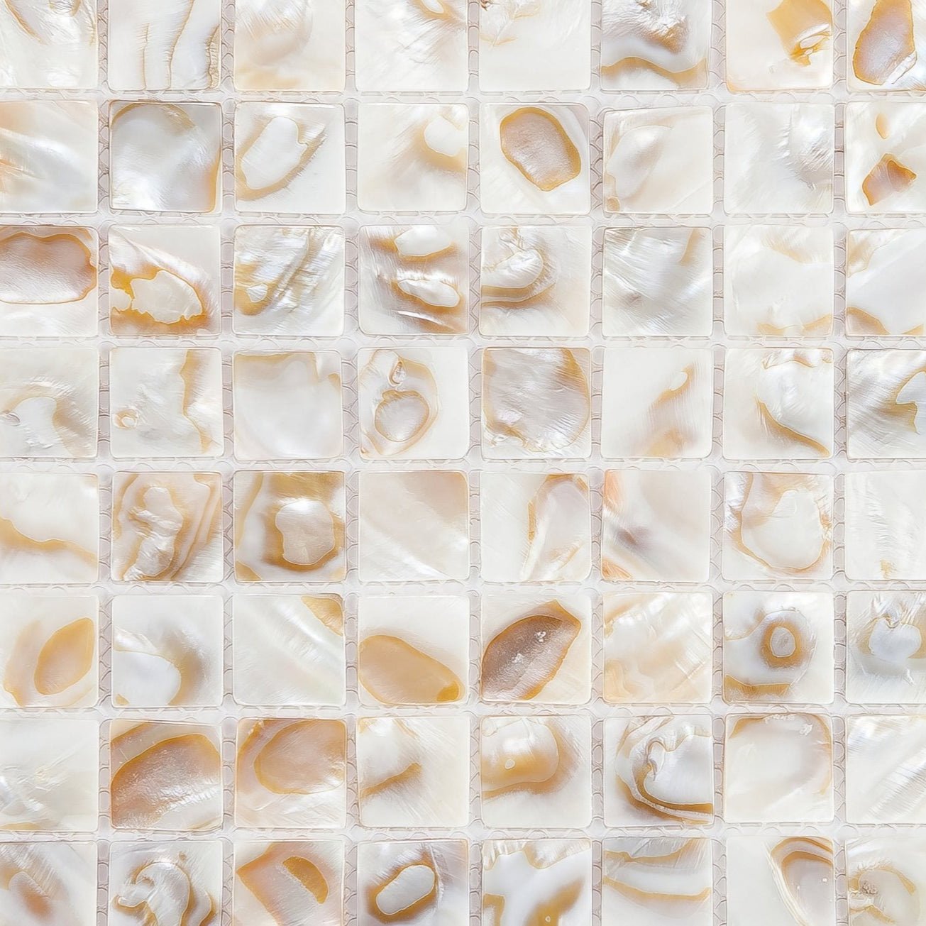 Beige and white mother-of-pearl mosaic tile biscotti 25mm square with natural iridescent patterns for decorative use