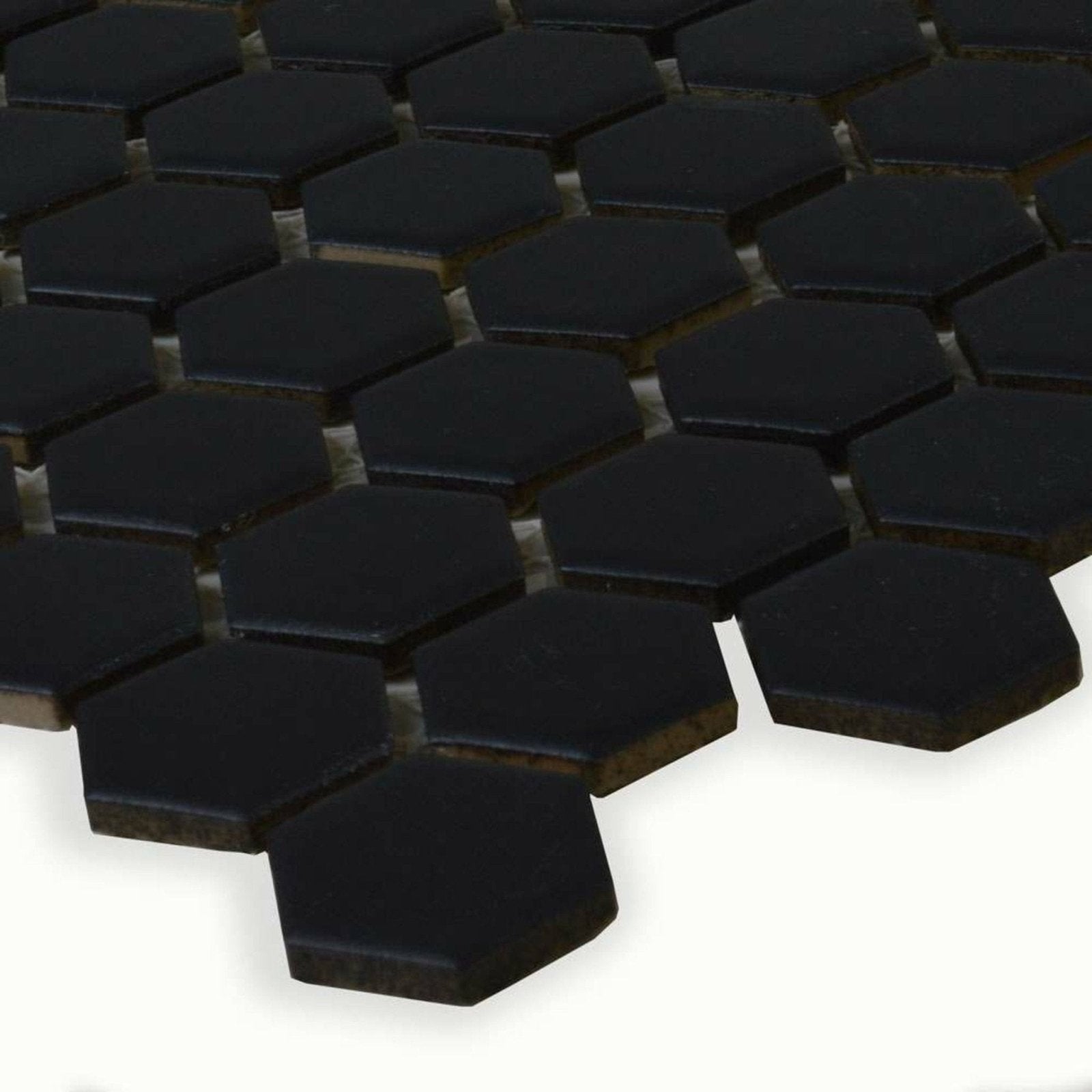 Black honeycomb floor mosaic featuring glossy black hexagonal ceramic tiles ideal for modern flooring designs