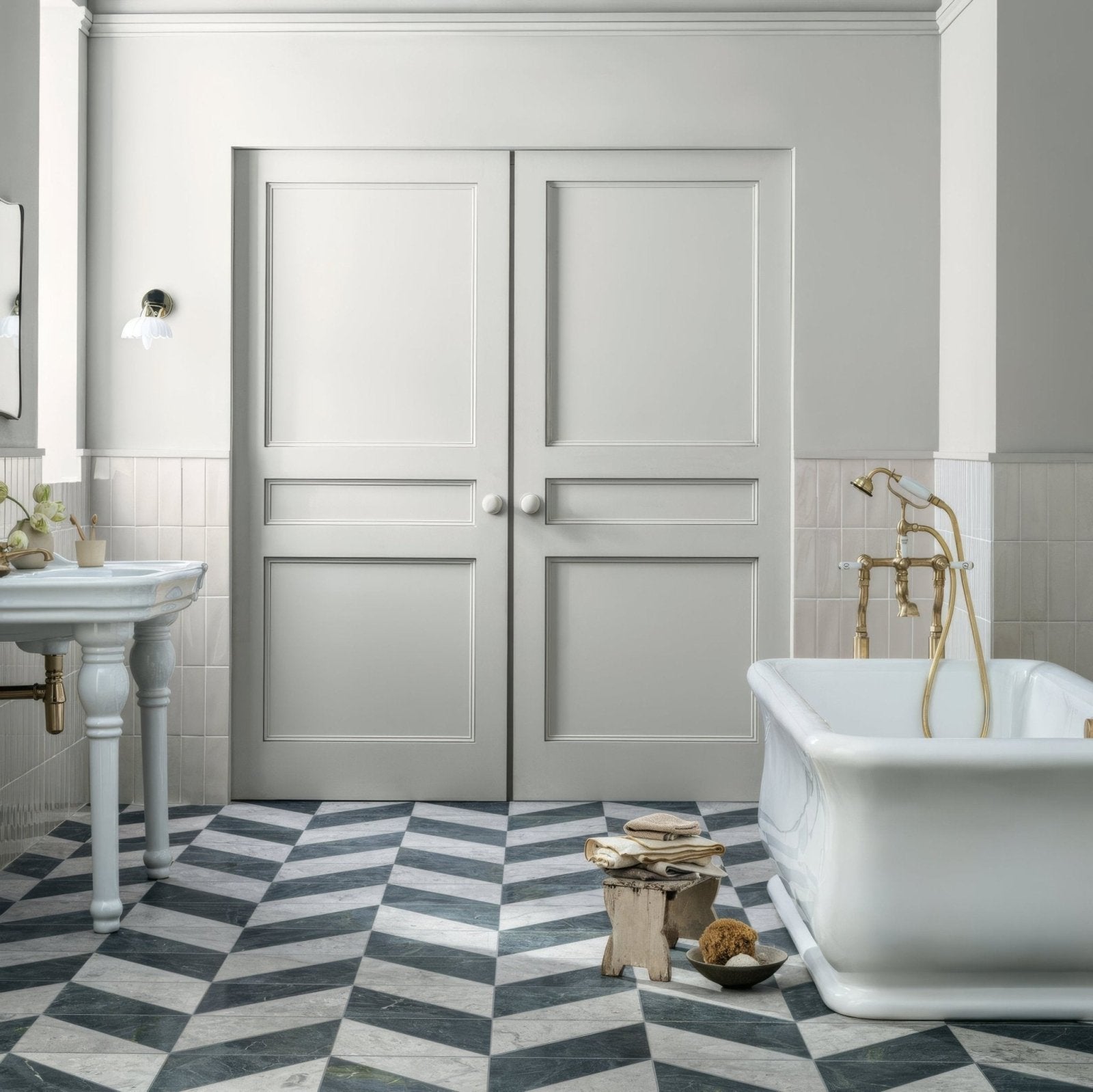 Blends Verde Triangle dark green marble triangle tiles with light grey panelled doors