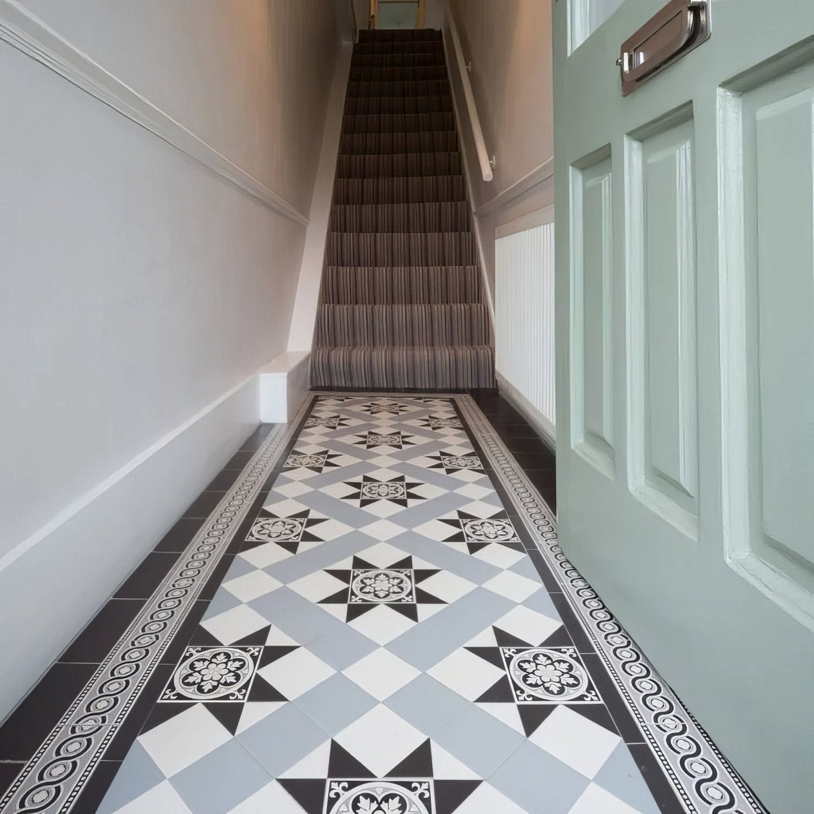 Blenheim black dover white and grey geometric floor tiles with ornate star-shaped medallions for hallway use