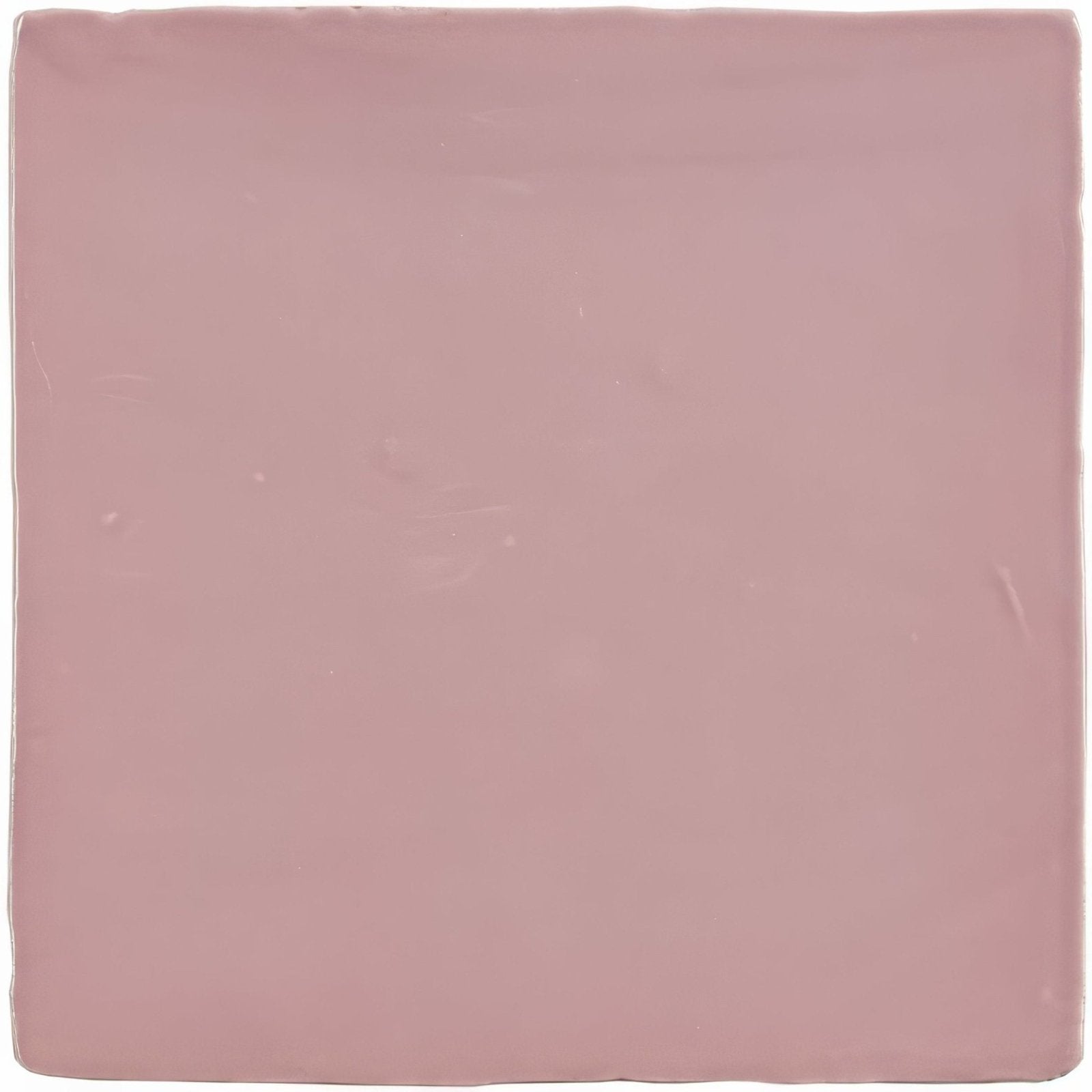 A square matte ceramic tile in soft dusty rose from the blossom field tile collection