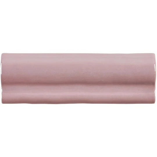 A sleek matte dusty rose ceramic blossom torus moulding tile with subtle glossy sheen and wave-like ridges