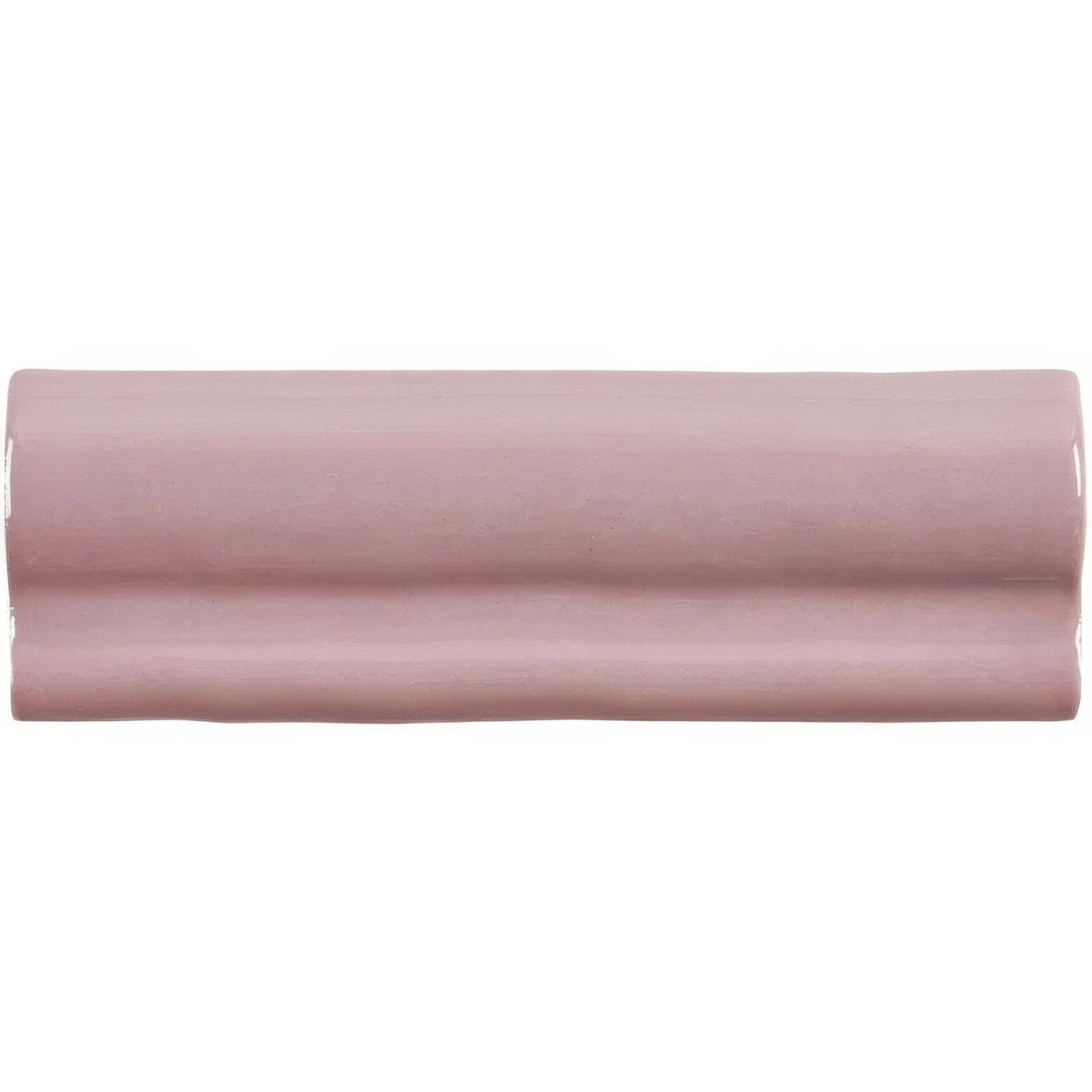 A sleek matte dusty rose ceramic blossom torus moulding tile with subtle glossy sheen and wave-like ridges