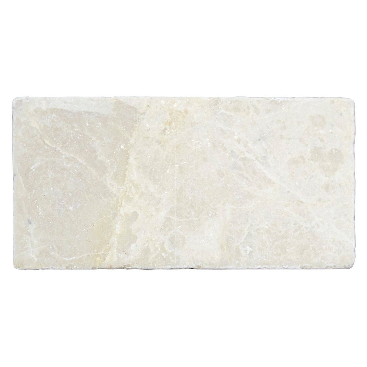 Cream-colored Bottocino tumbled marble rectangular tile 150 x 75mm with natural veining and textured surface