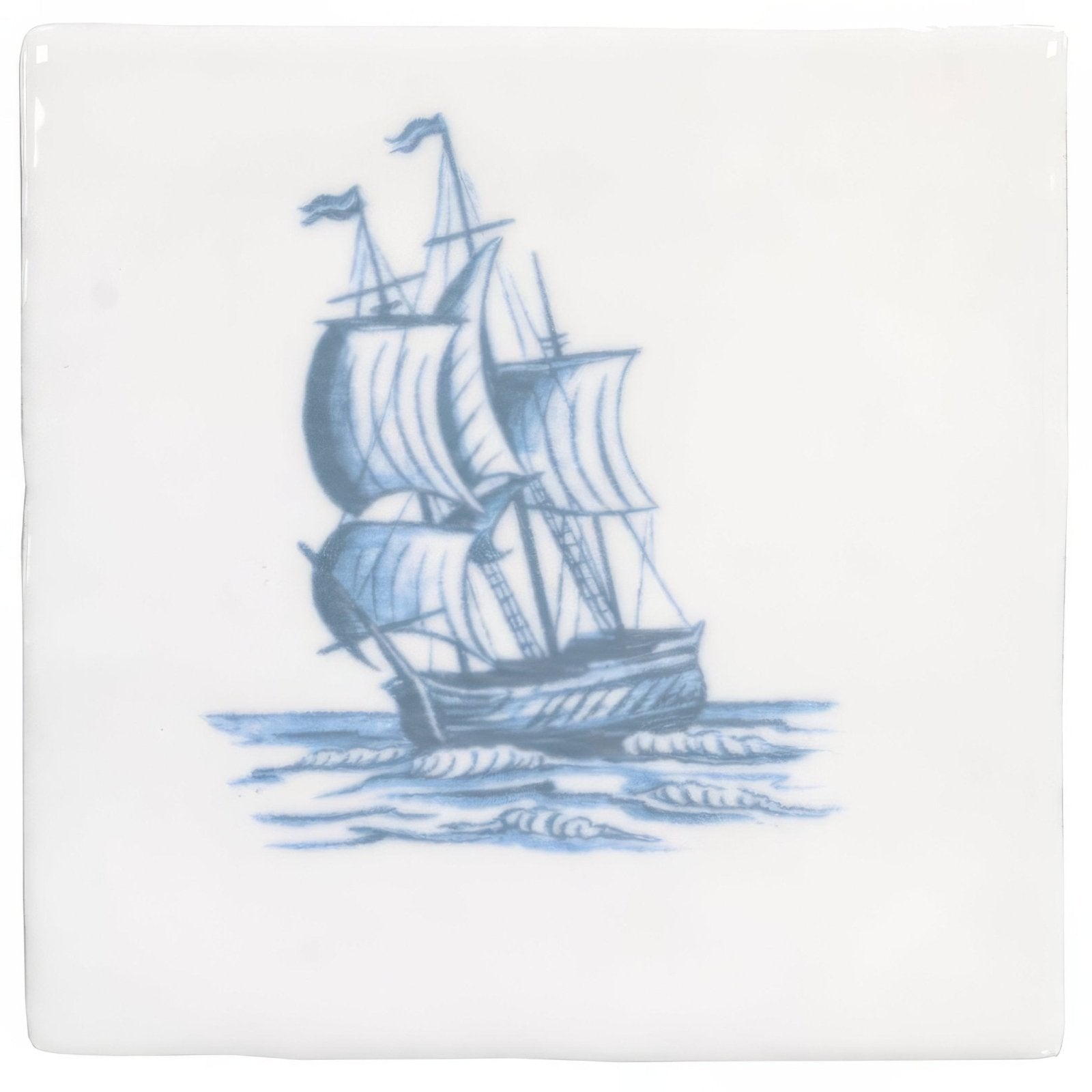 White ceramic tile with blue hand-painted brigg sailing ship illustration on cotton fabric background