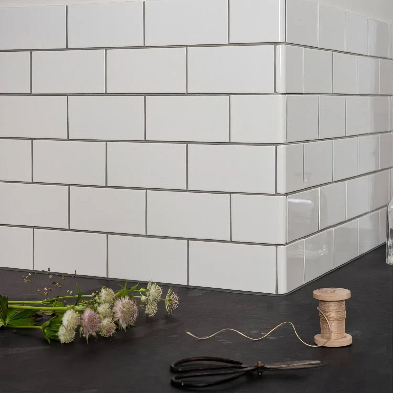 Brilliant white half tile with white subway design and thin gray grout lines for wall and backsplash use